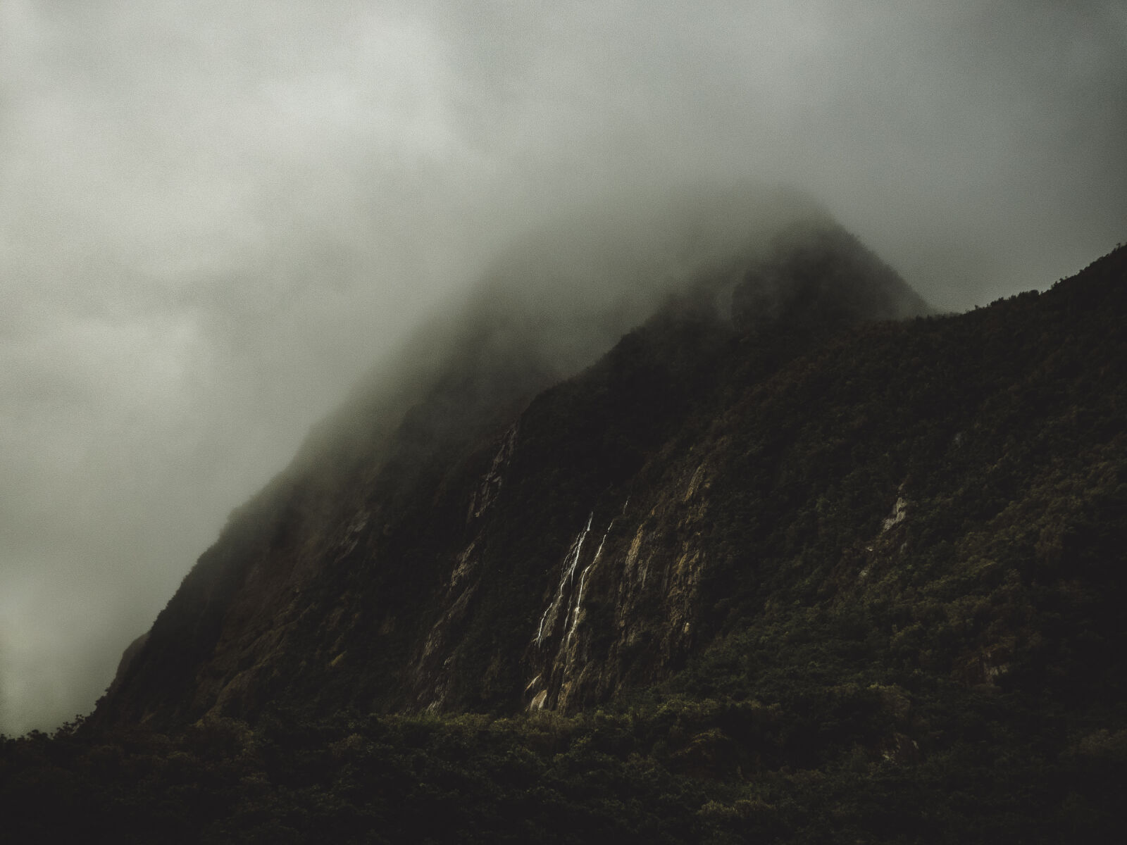 Panasonic Lumix DMC-FZ300 sample photo. Cliff, foggy, gloomy, hazy photography