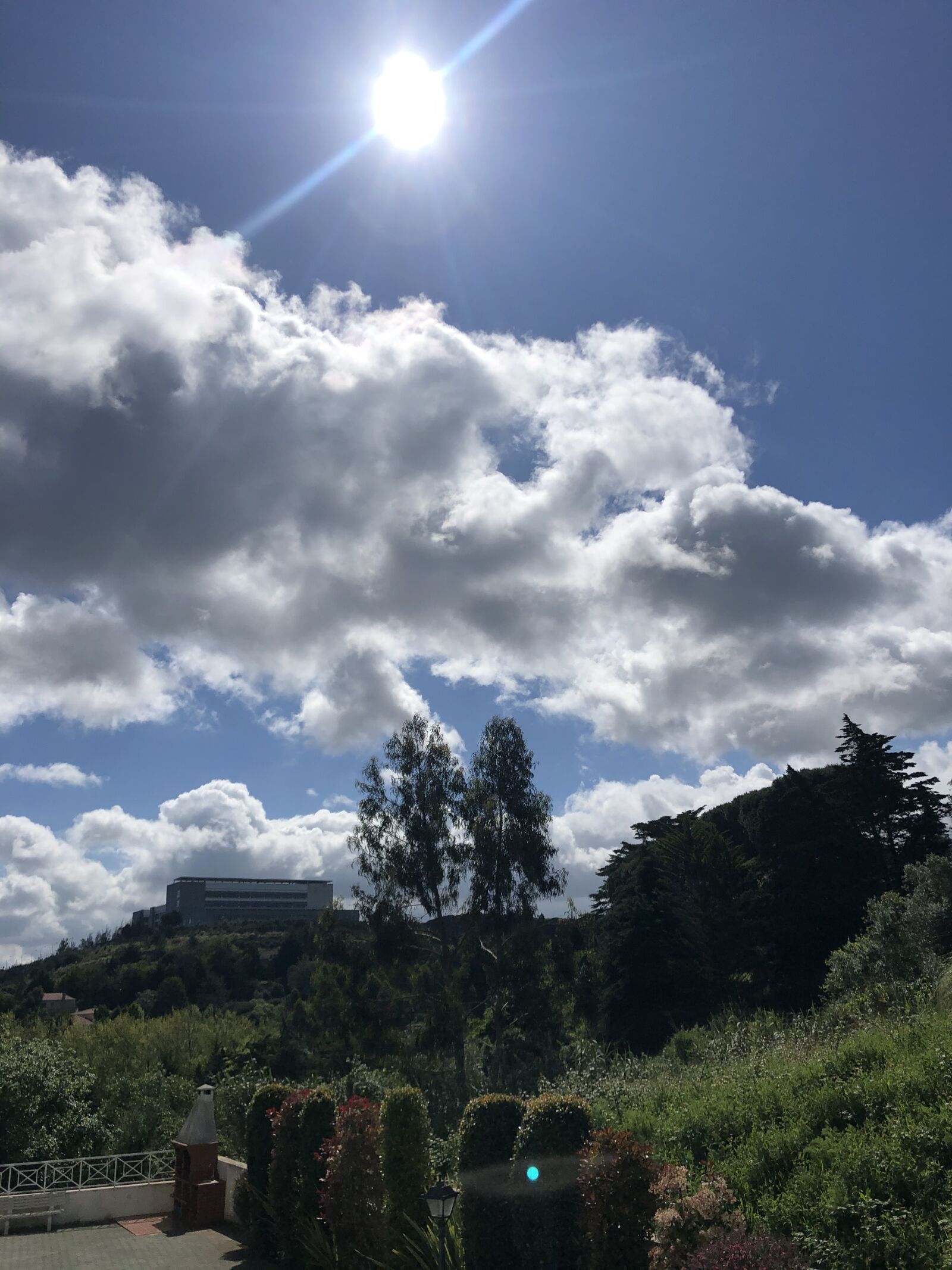 iPhone X back dual camera 4mm f/1.8 sample photo. Sun, clouds, weather photography