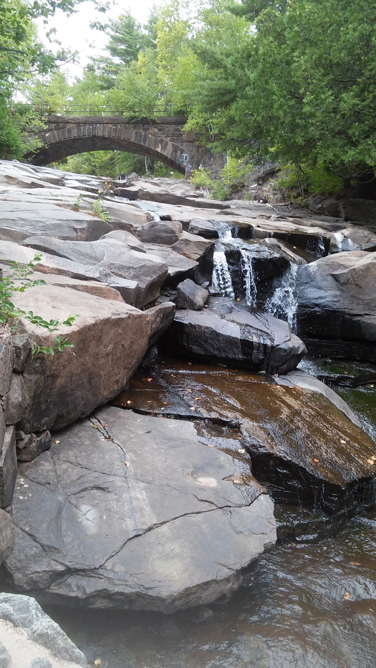 LG VOLT sample photo. Bridge, river, rocks, waterfall photography