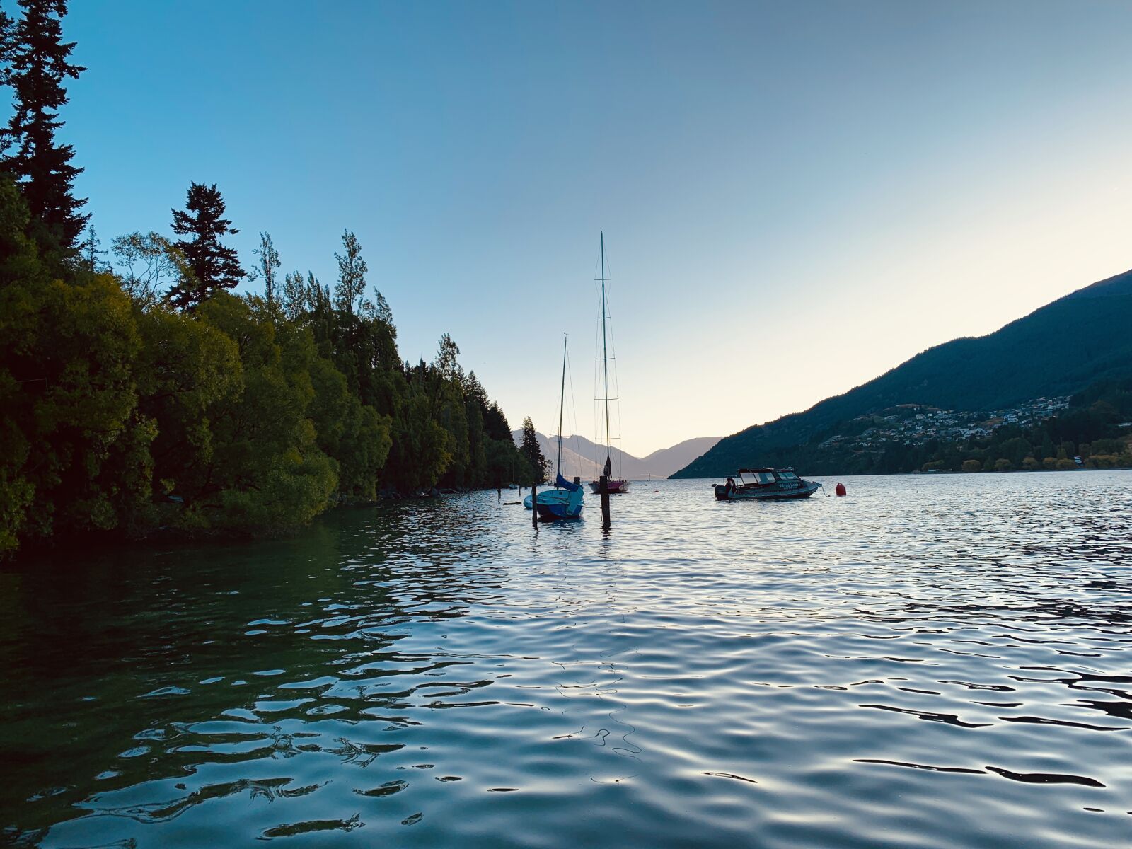 iPhone XS back dual camera 4.25mm f/1.8 sample photo. Boat, sail, mountains photography