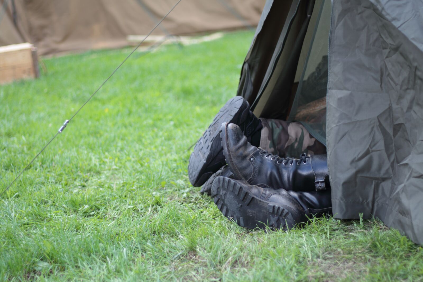 Canon EOS 700D (EOS Rebel T5i / EOS Kiss X7i) + Canon EF 50mm F1.8 STM sample photo. Camp, tent, combat boots photography