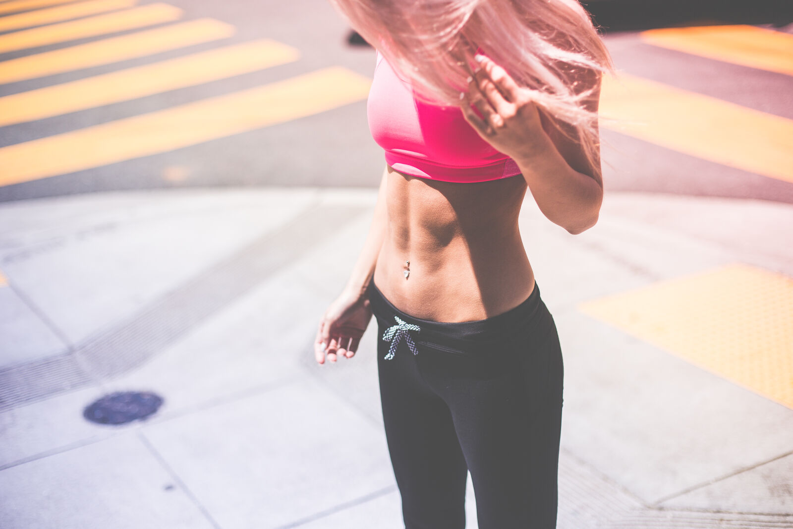 Canon EF 50mm F1.4 USM sample photo. Woman, wearing, pink, sports photography