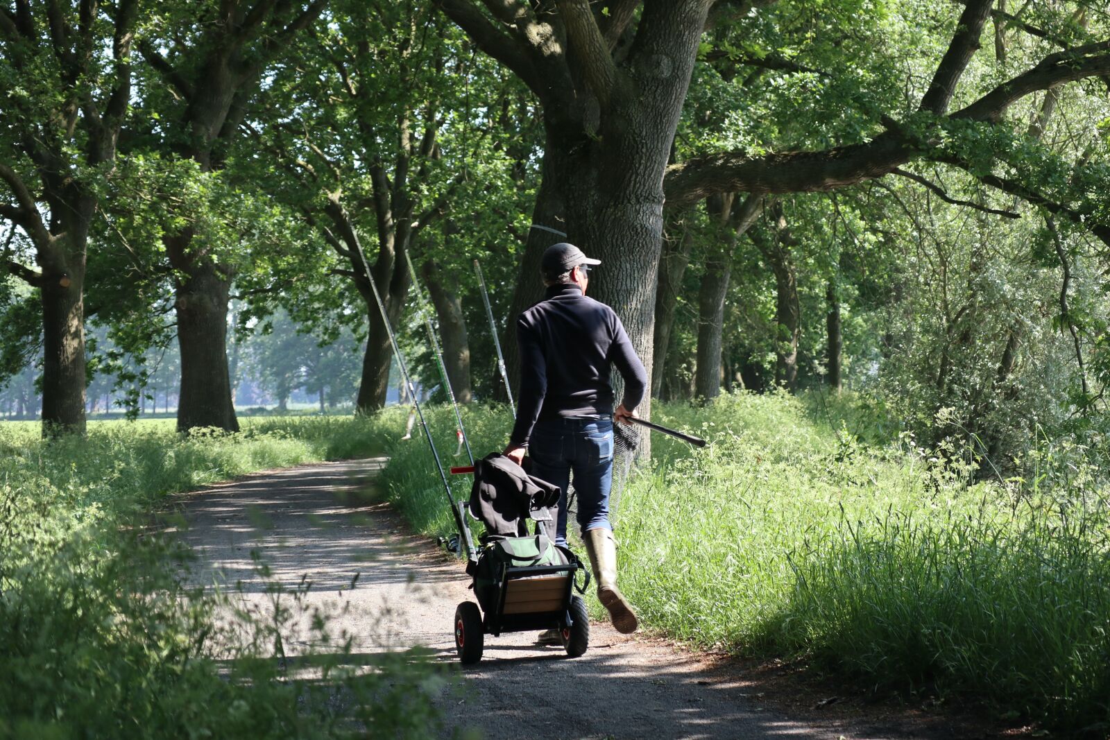 Canon EOS M100 sample photo. Fisherman, path, landscape photography