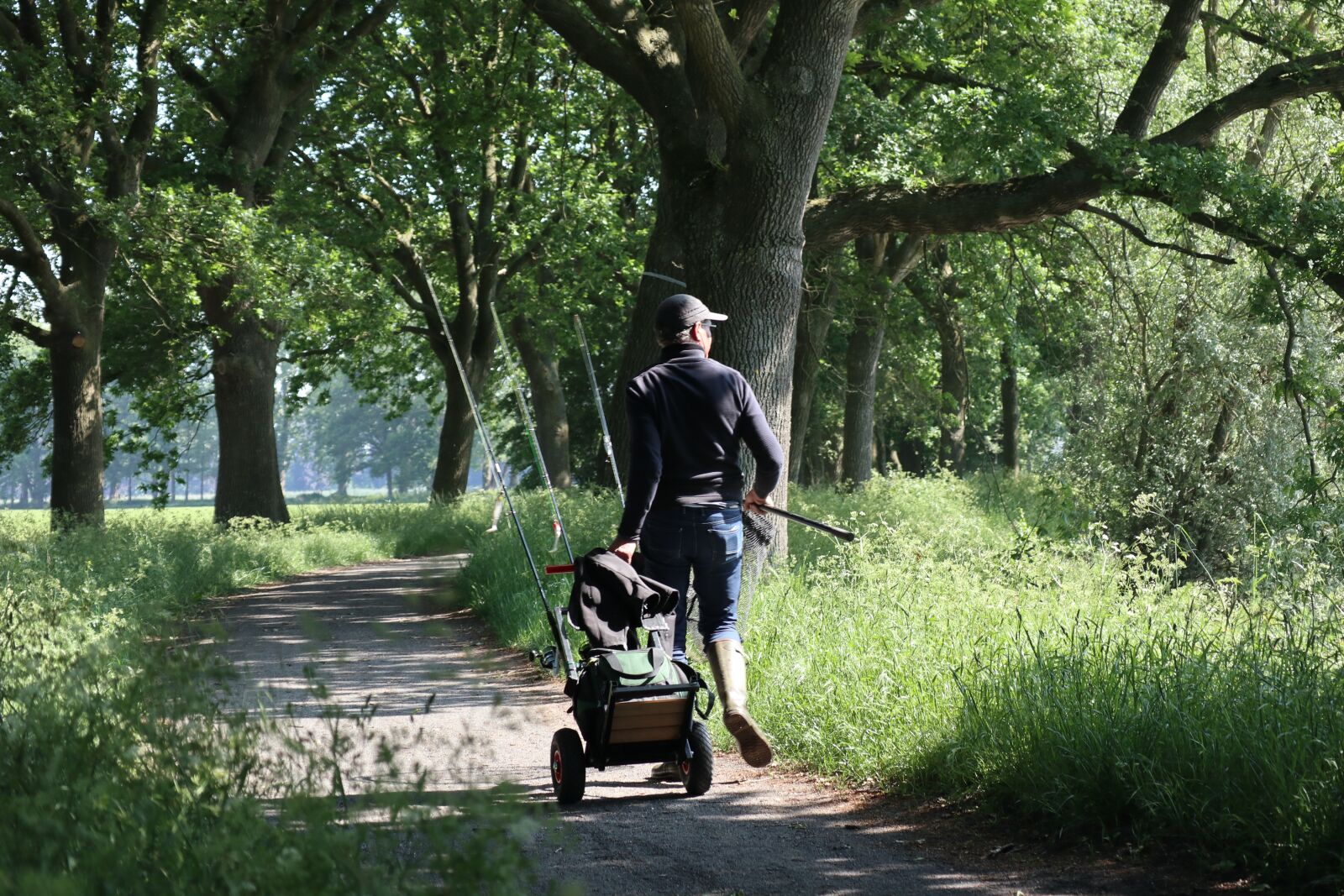 Canon EOS M100 + Canon EF-M 55-200mm F4.5-6.3 IS STM sample photo. Fisherman, path, landscape photography