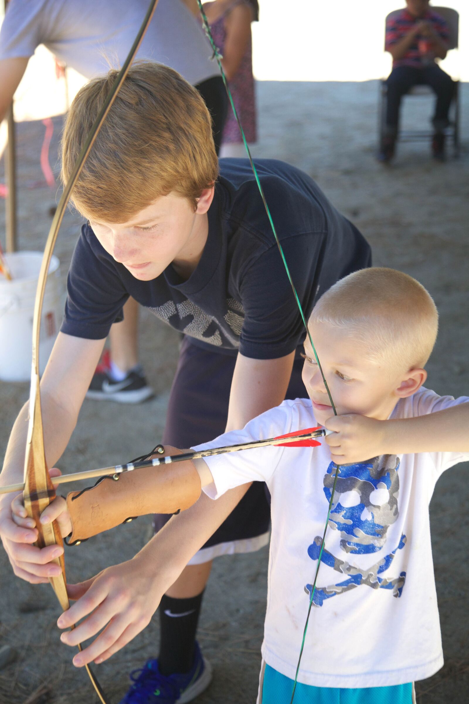 Canon EOS 5D Mark II sample photo. Children, shooting, bow, arrow photography