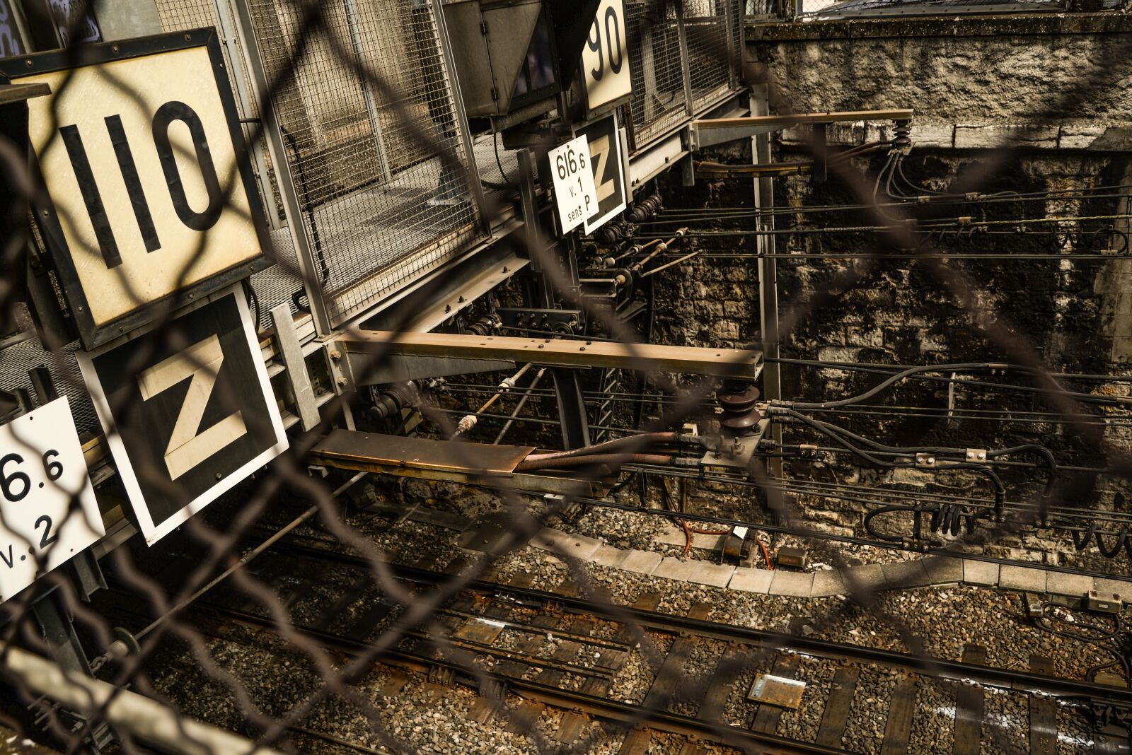 Nikon D610 sample photo. Tracks, fence, rust photography