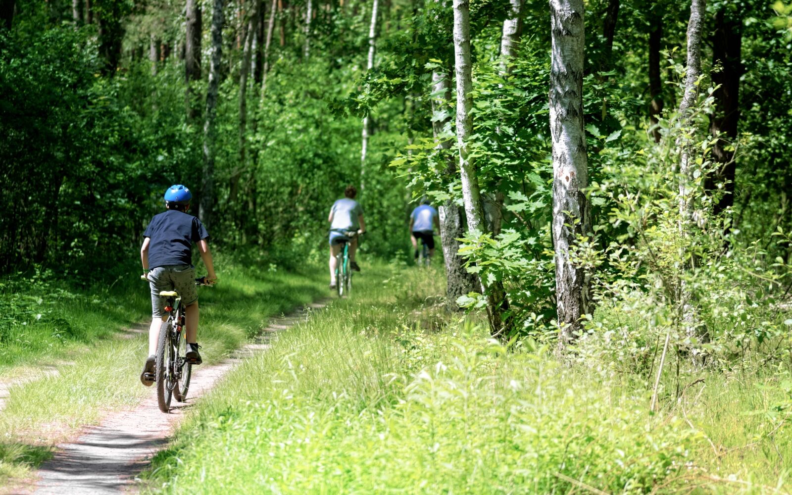 Nikon D5100 sample photo. Cyclists, young people, while photography