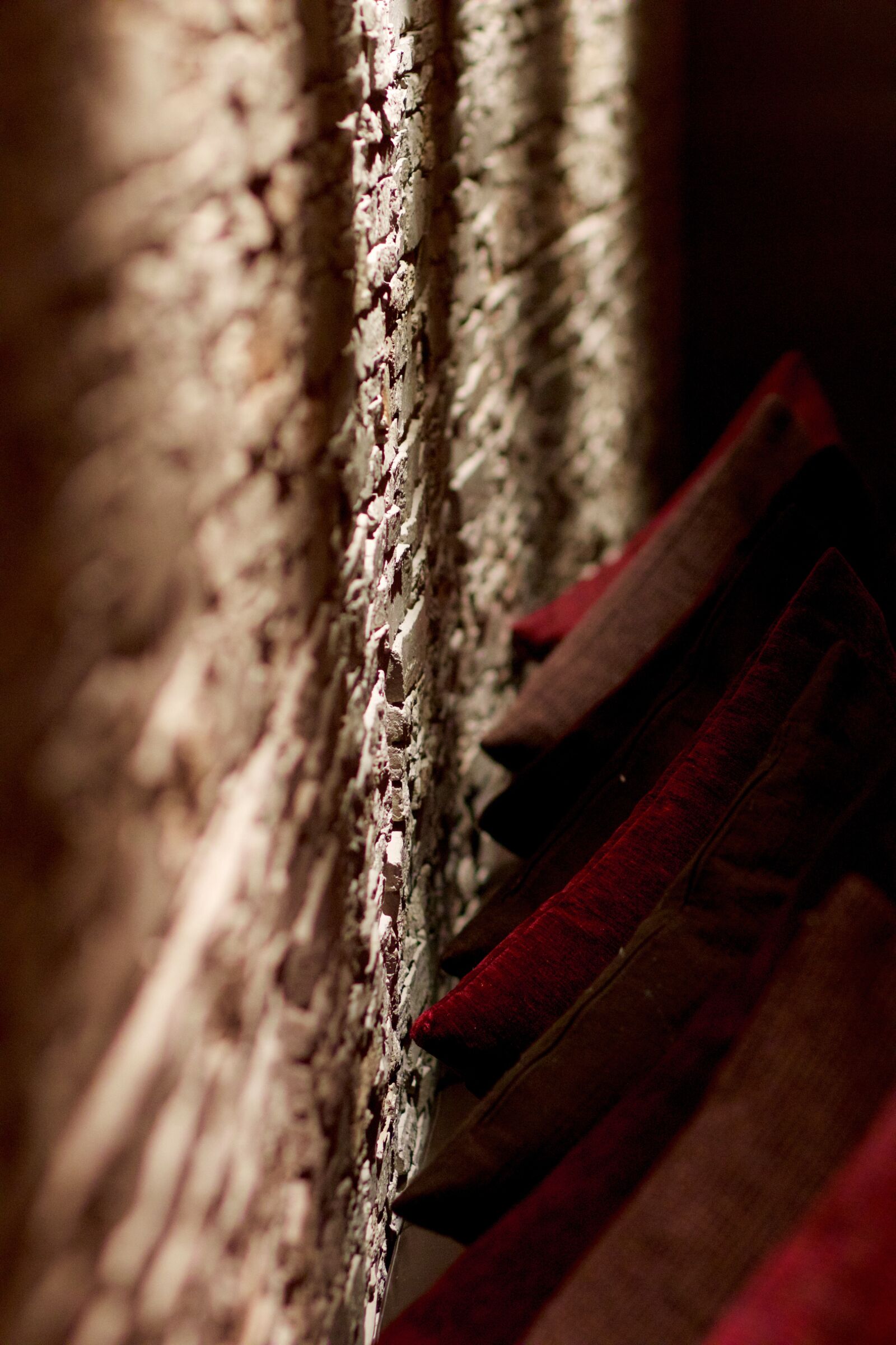 Canon EOS 70D + Canon EF 85mm F1.8 USM sample photo. Stone wall, wall, pillow photography