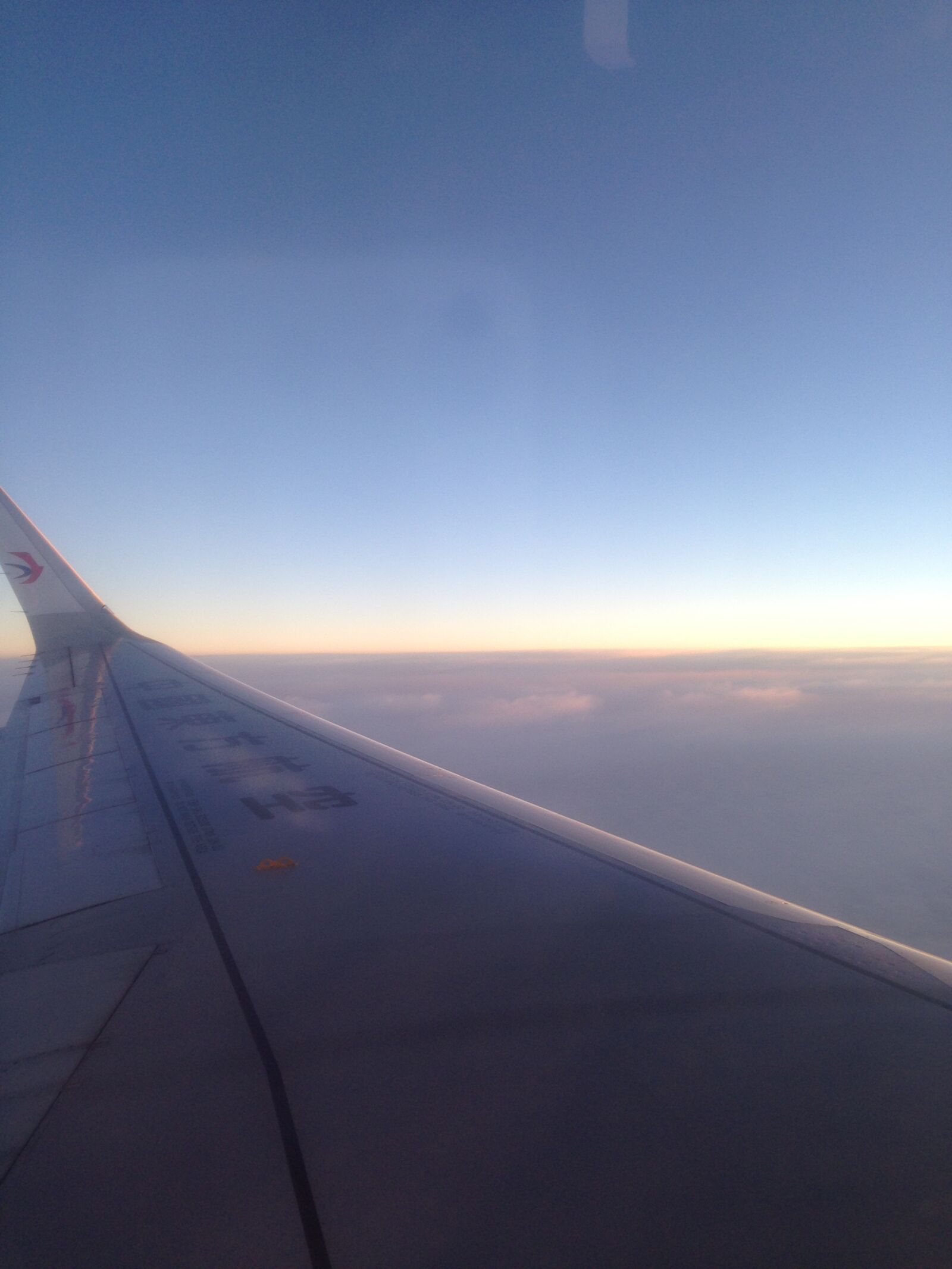Apple iPhone 5 sample photo. Flying, plane, sunrise photography
