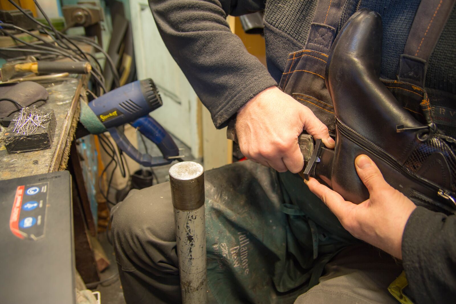 Canon EOS 60D sample photo. Shoe repair, shoemaker, trimming photography