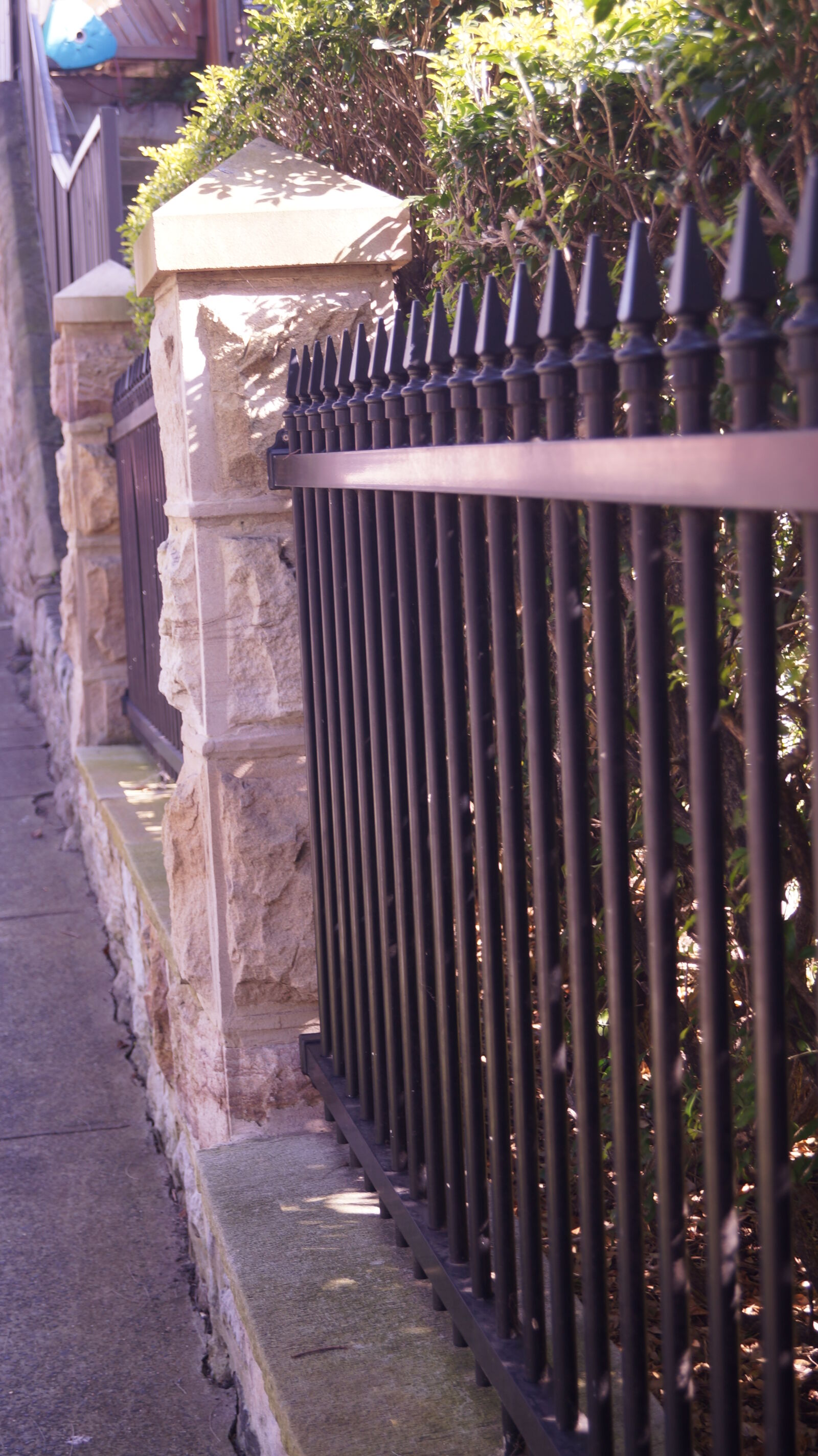 Sony SLT-A37 sample photo. Brick, fence, iron photography