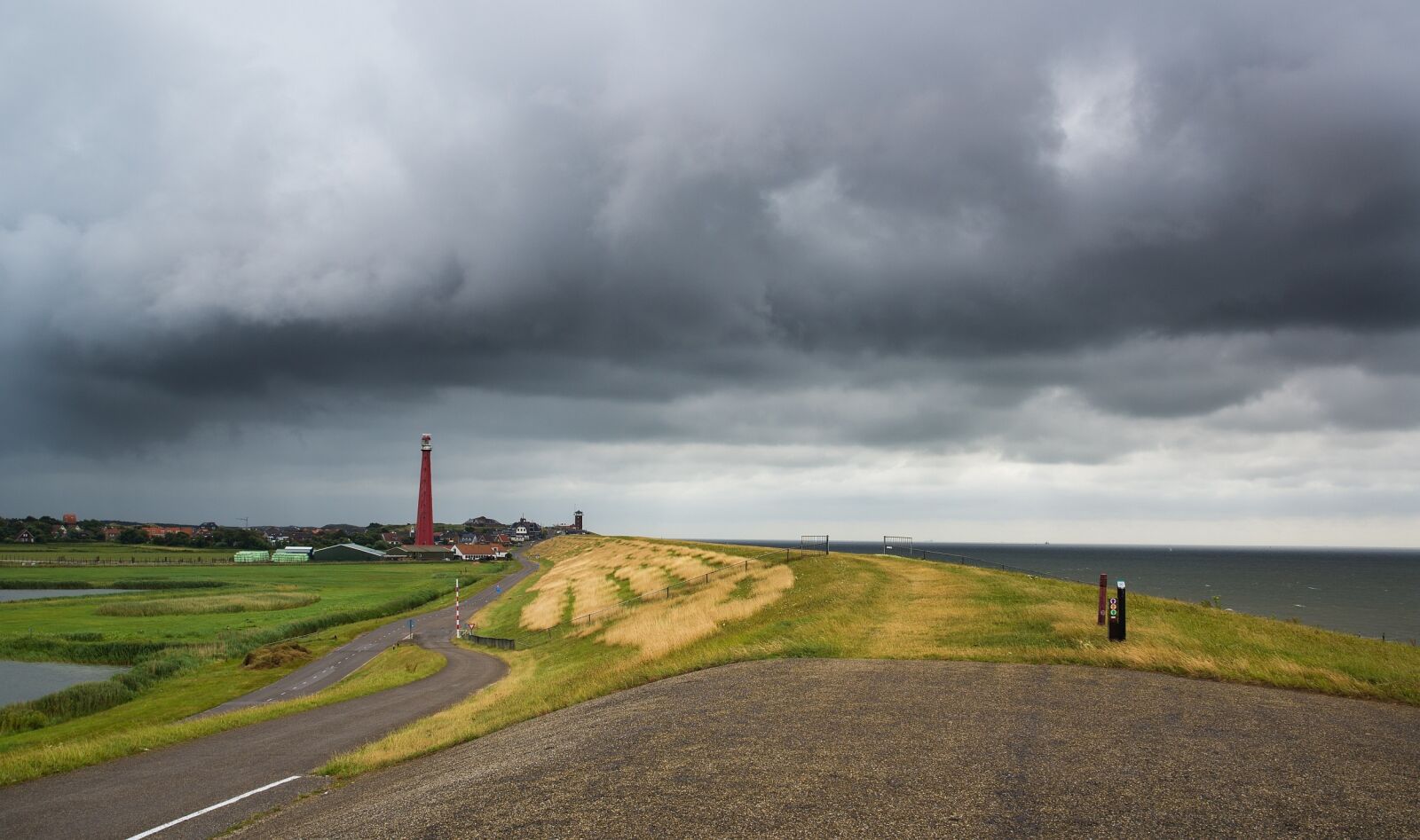 Nikon D600 sample photo. Thunderstorm, lighthouse, dike photography