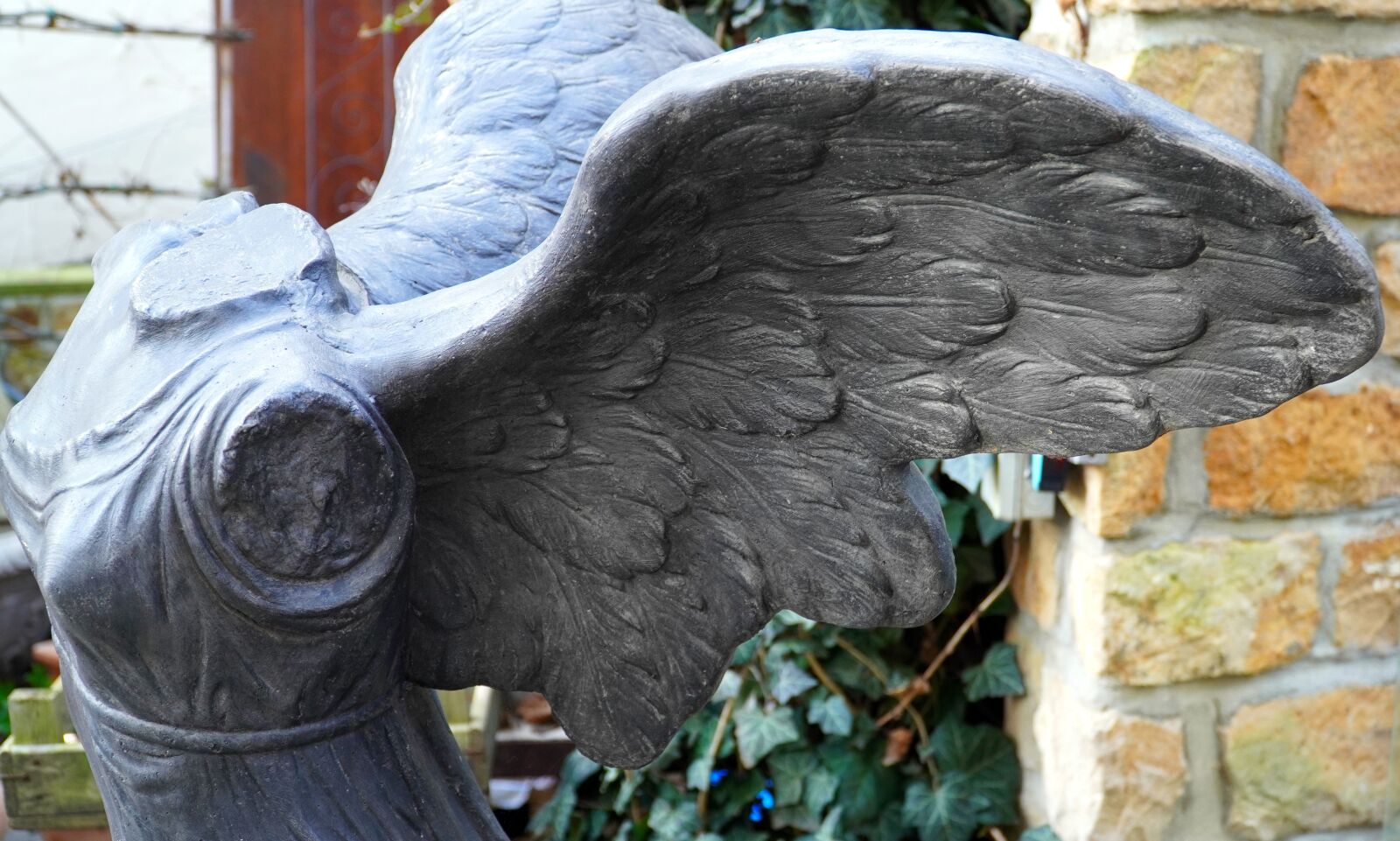 Sony E PZ 18-105mm F4 G OSS sample photo. Wing, angel, sculpture photography