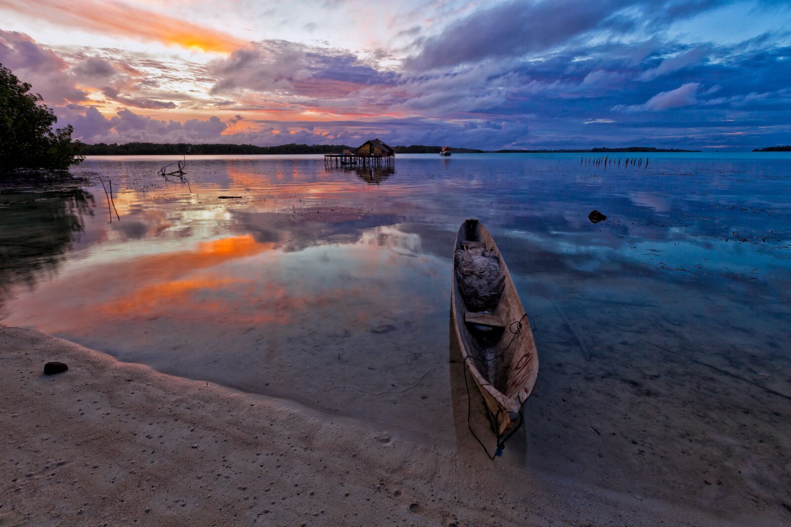 Canon EOS 5D Mark II sample photo. At dusk, lagoon, boat photography