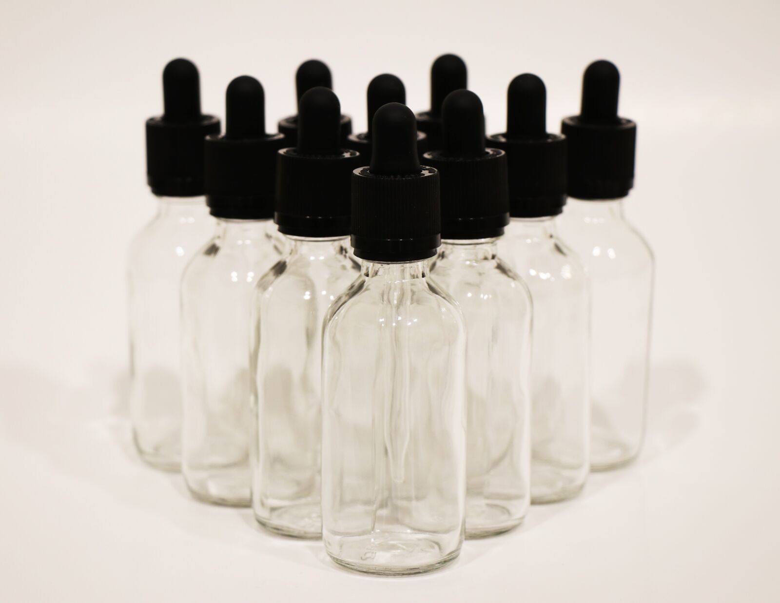 Canon EF-S 18-135mm F3.5-5.6 IS USM sample photo. Clear glass, dropper, bottles photography