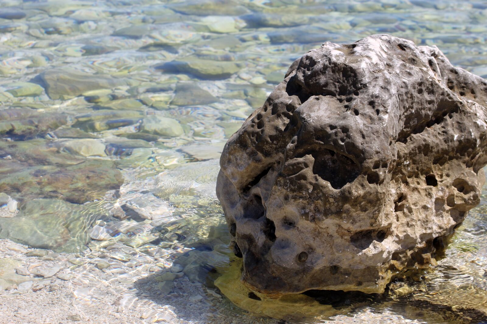 Canon EF 55-200mm F4.5-5.6 II USM sample photo. Stone, hole, leaky photography