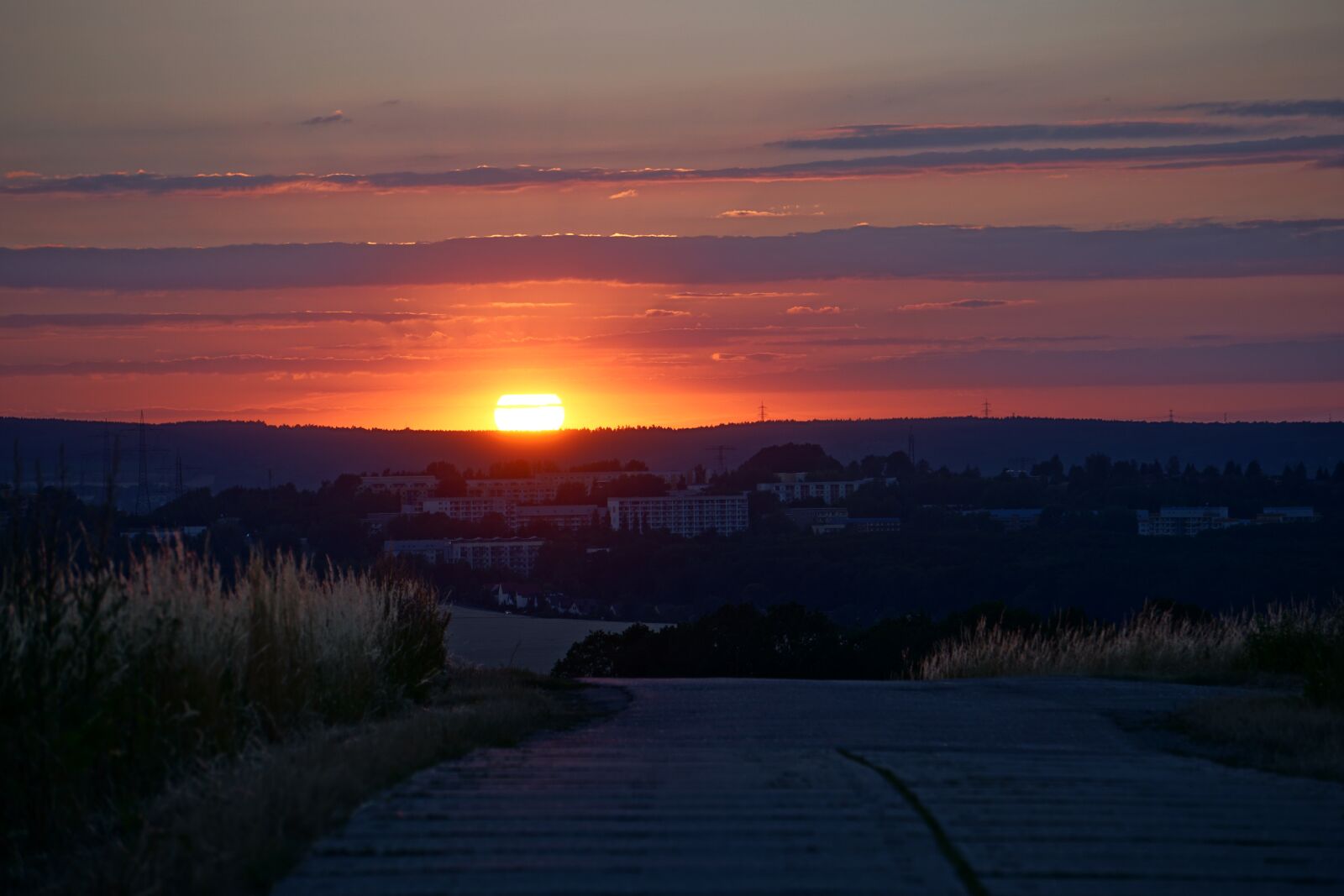 Sony E 55-210mm F4.5-6.3 OSS sample photo. Sunset, hill, city photography