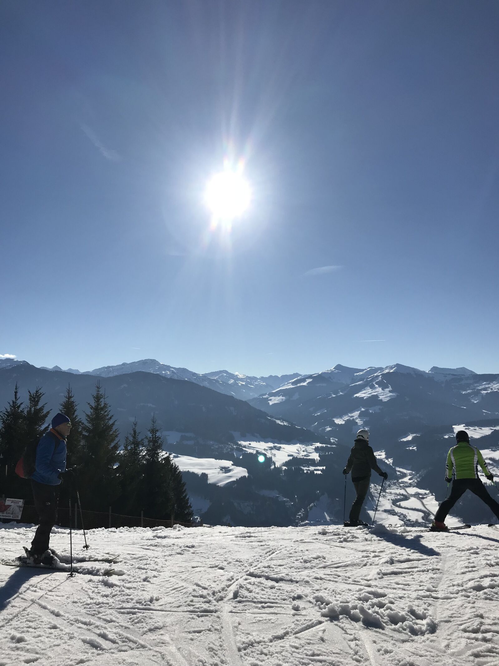 iPhone 7 back camera 3.99mm f/1.8 sample photo. Snow, sun, ski photography
