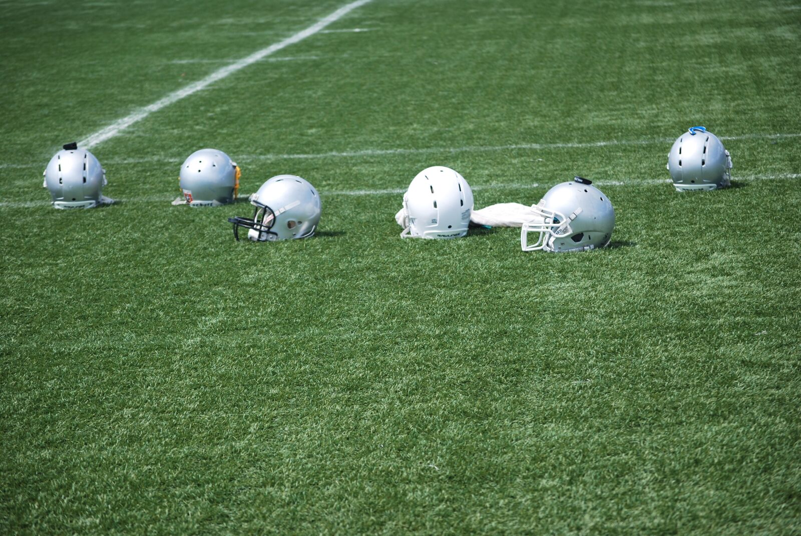 Nikon D60 sample photo. The pitch, match, helmet photography