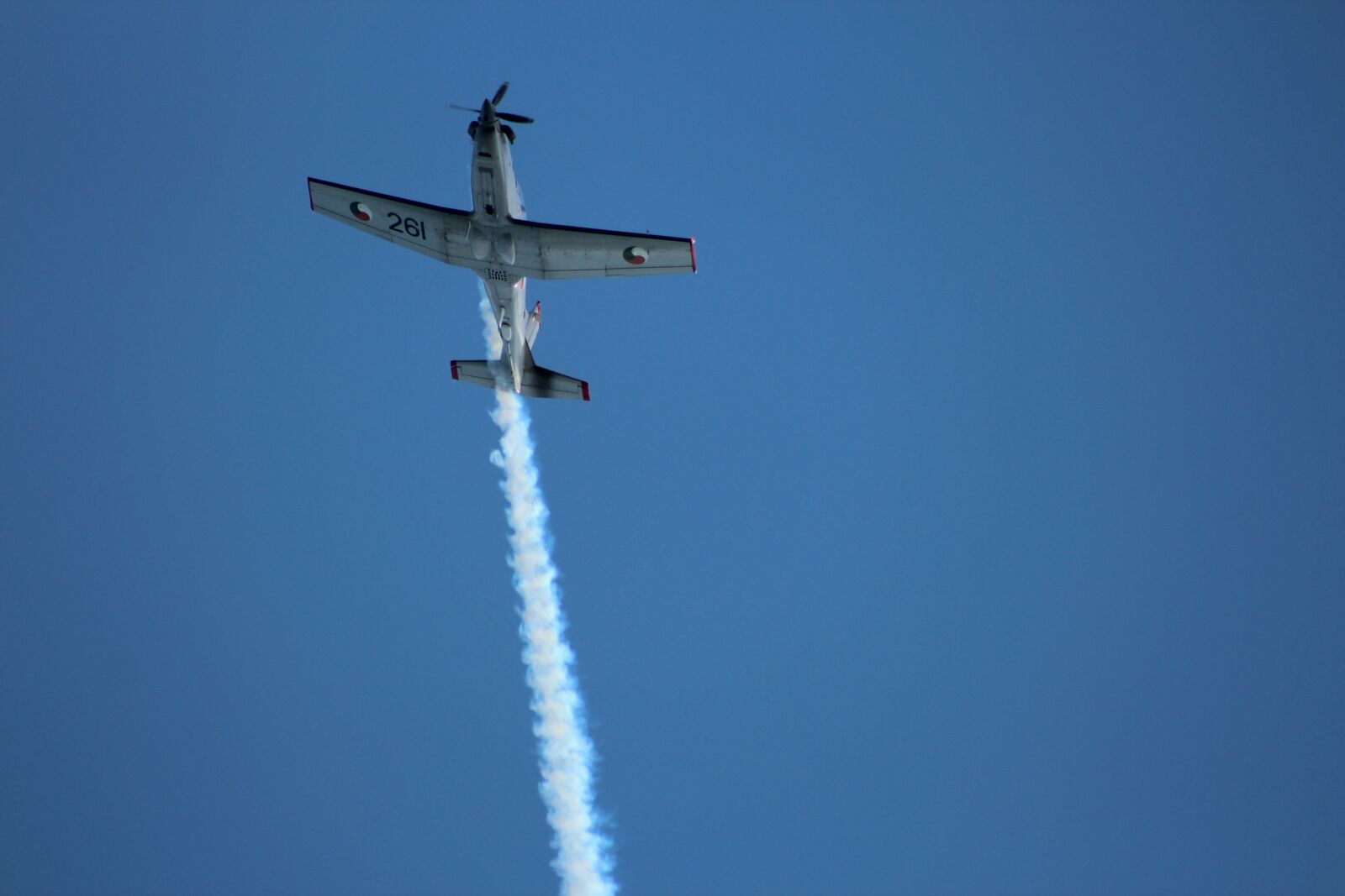 Canon EF 75-300mm f/4-5.6 USM sample photo. Airplane, airshow, smoke photography