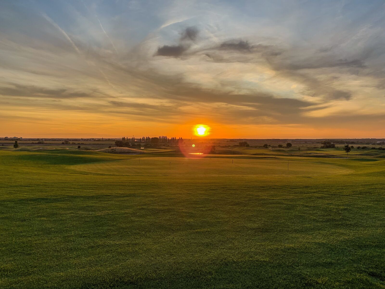 Apple iPhone XS sample photo. Sunset, sky, golf court photography