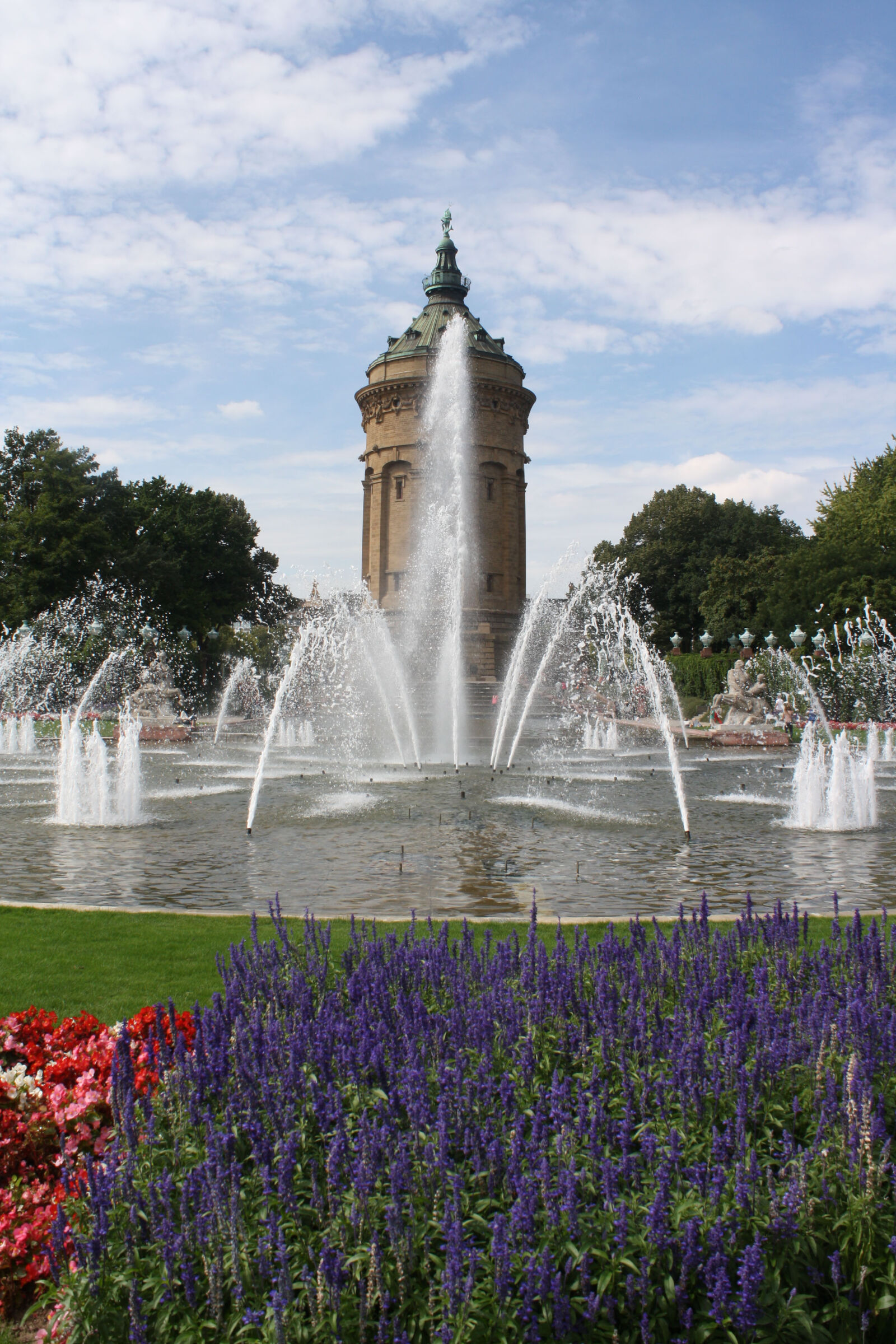 Canon EOS 1000D (EOS Digital Rebel XS / EOS Kiss F) sample photo. Flowers, fountain, park, tower photography