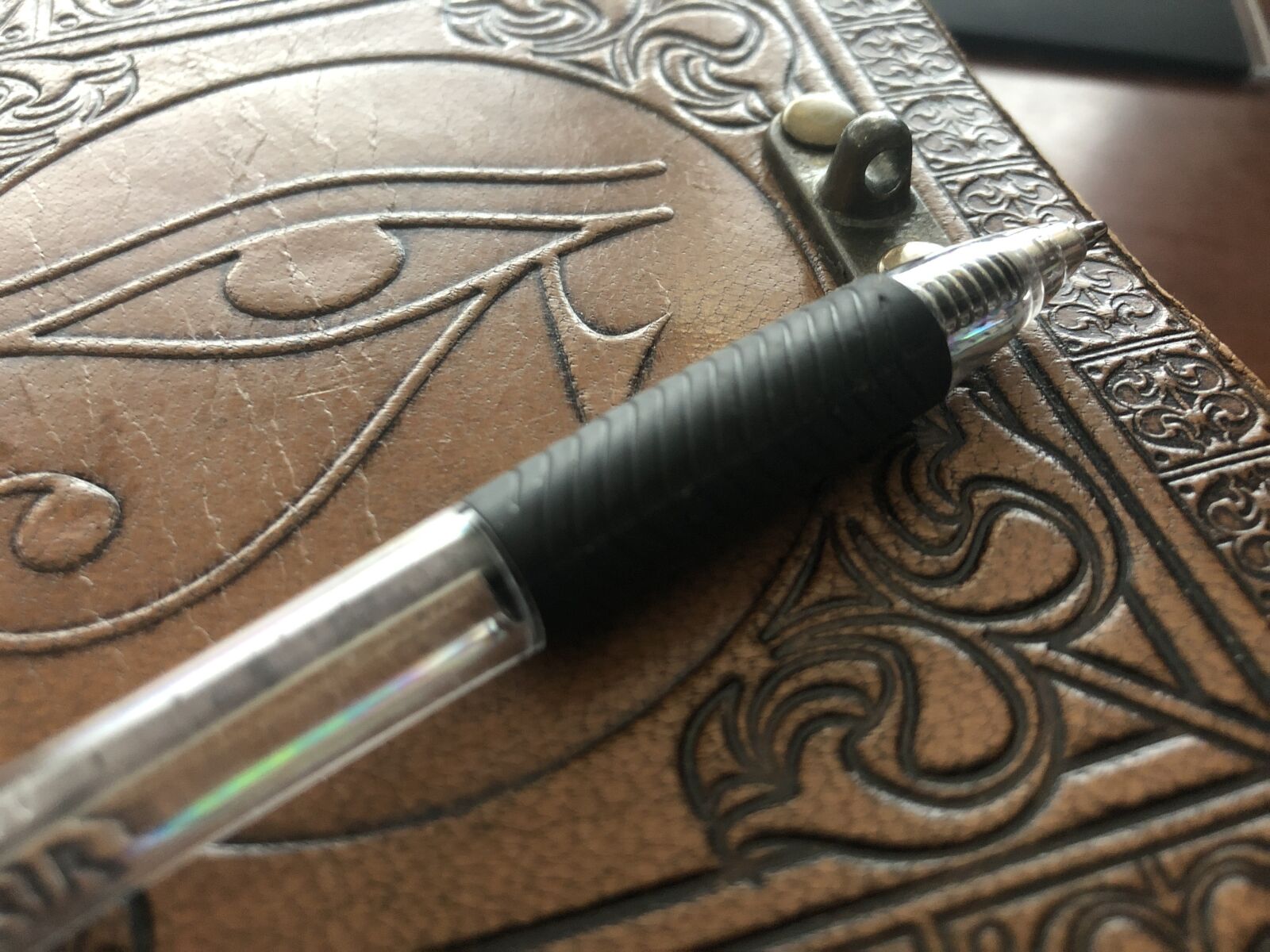 iPhone X back dual camera 4mm f/1.8 sample photo. Notebook, eye, pen photography