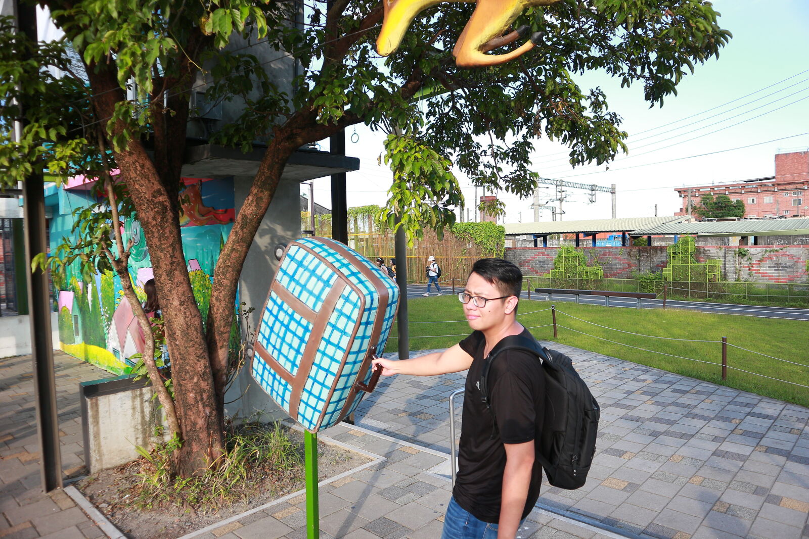 Canon EOS M sample photo. Woman, standing, with, umbrella photography