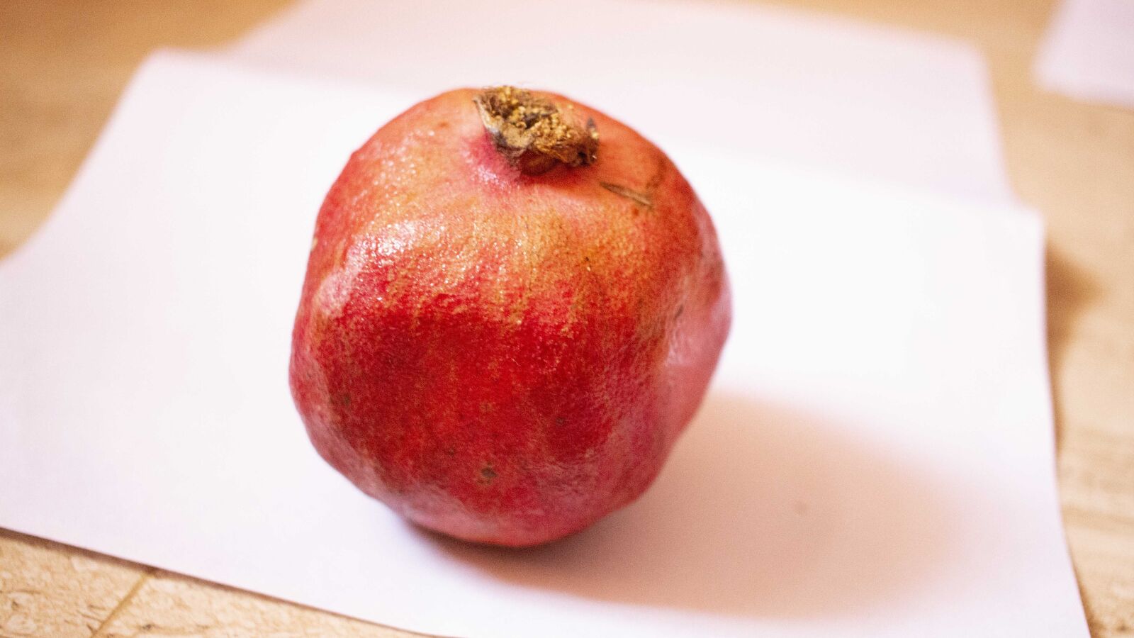 Canon EF-S 24mm F2.8 STM sample photo. Pomegranate, red, fruit photography