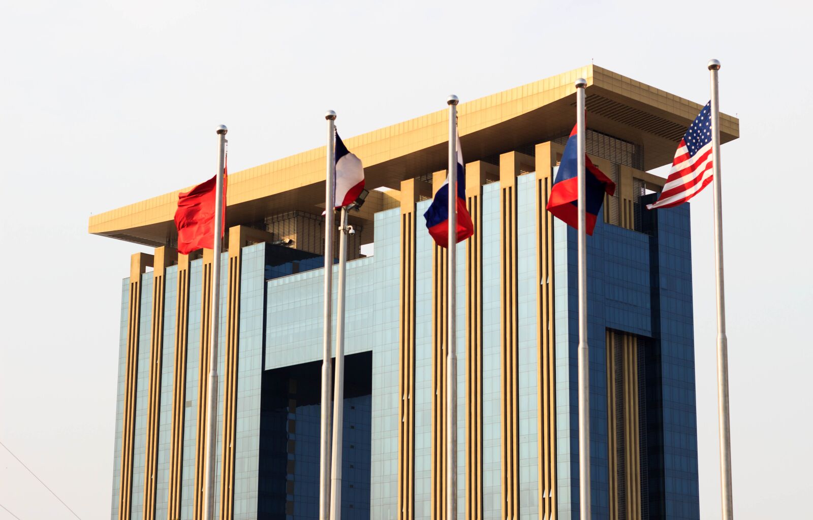 Canon EOS 600D (Rebel EOS T3i / EOS Kiss X5) + Canon EF 50mm F1.8 STM sample photo. Building, flags, corporation photography