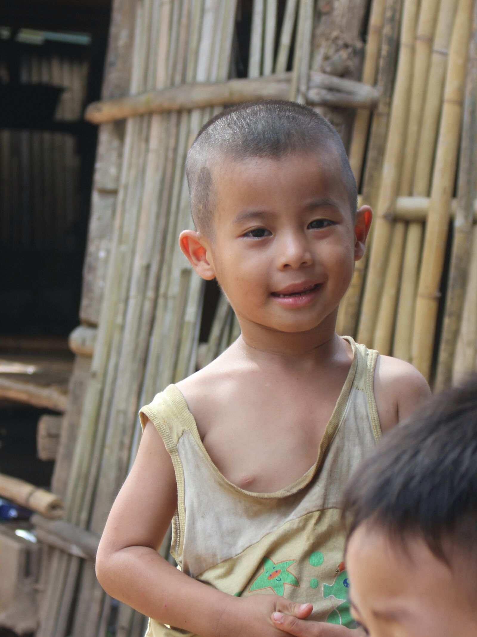 Canon EOS 700D (EOS Rebel T5i / EOS Kiss X7i) sample photo. Child, smile, poor photography