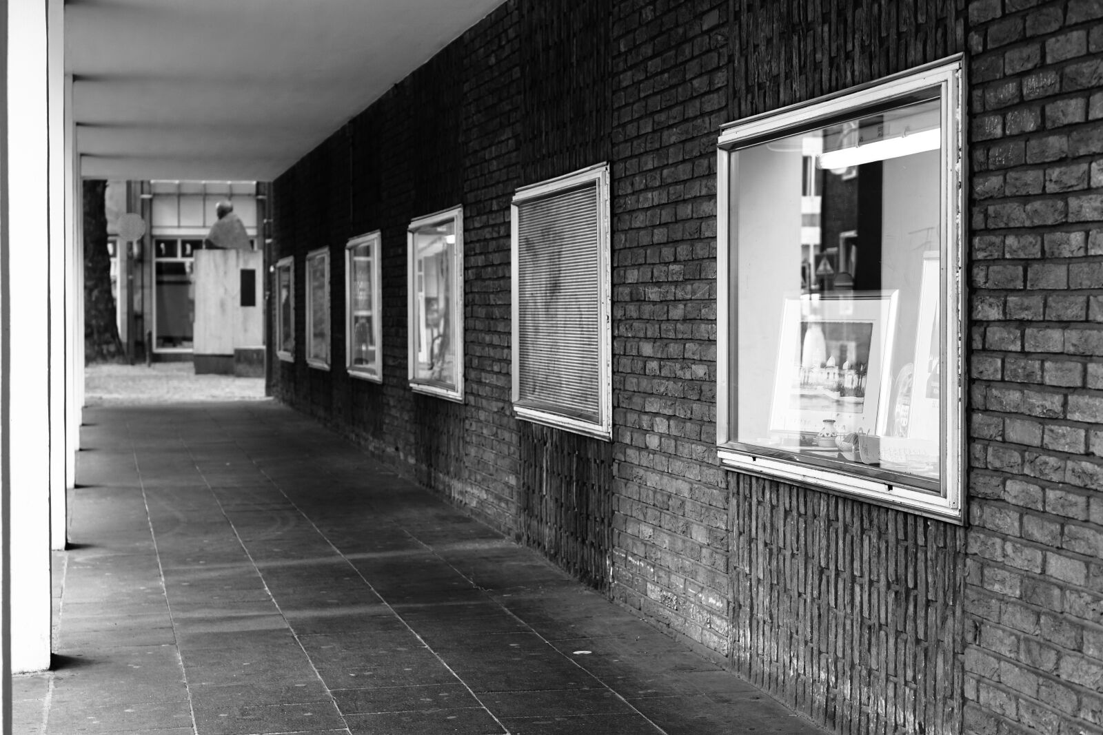 E 50mm F1.8 OSS sample photo. Cologne, underpass, boxes photography