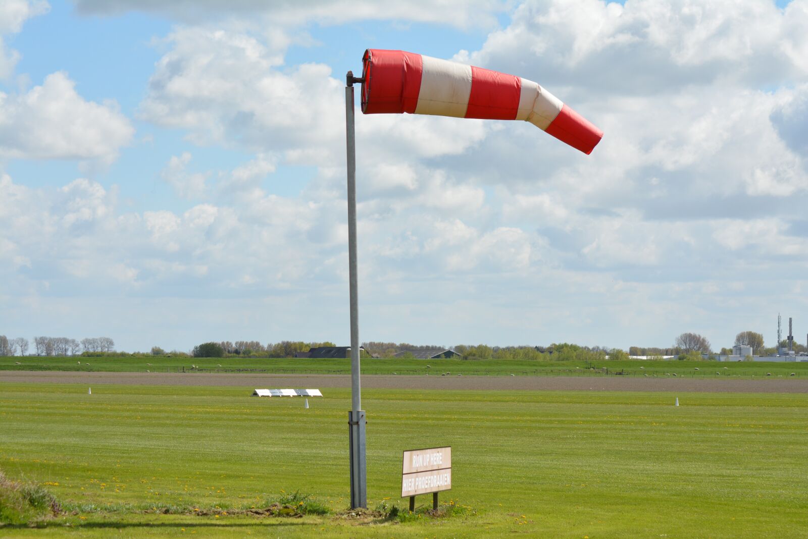 Nikon D5200 sample photo. Windsock, pasture, airport photography