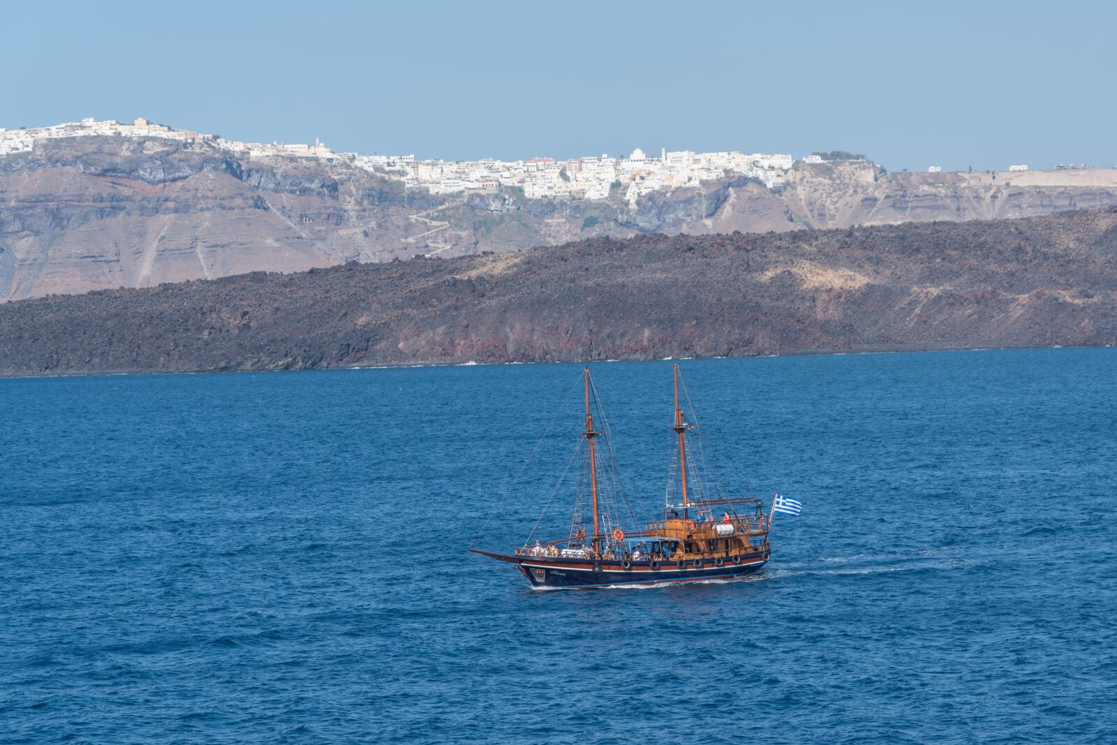 Sony a7R II + Sony FE 24-240mm F3.5-6.3 OSS sample photo. Santorini, pirate ship, mountains photography