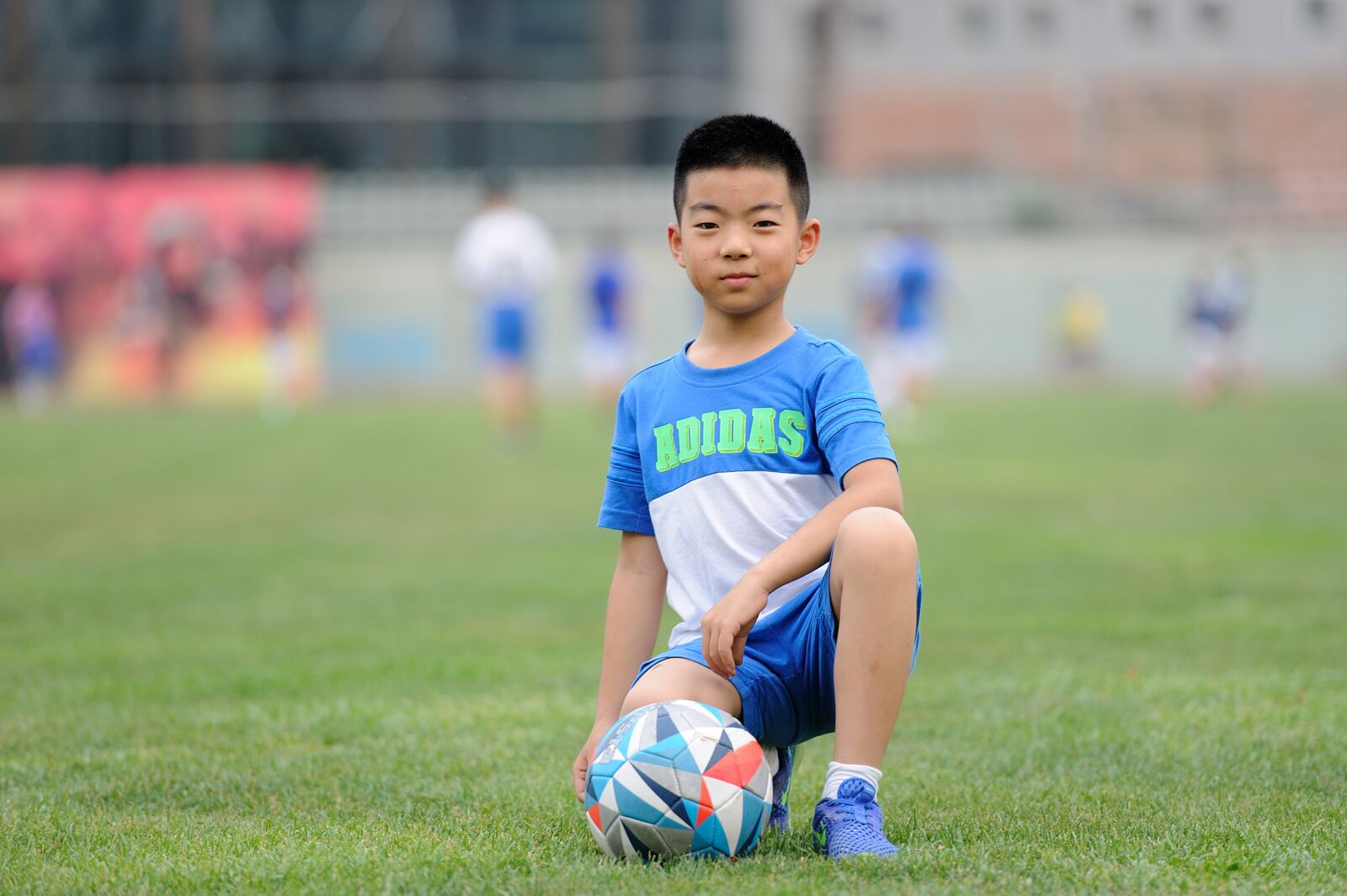 Nikon D700 sample photo. Football, teenager, greenery photography