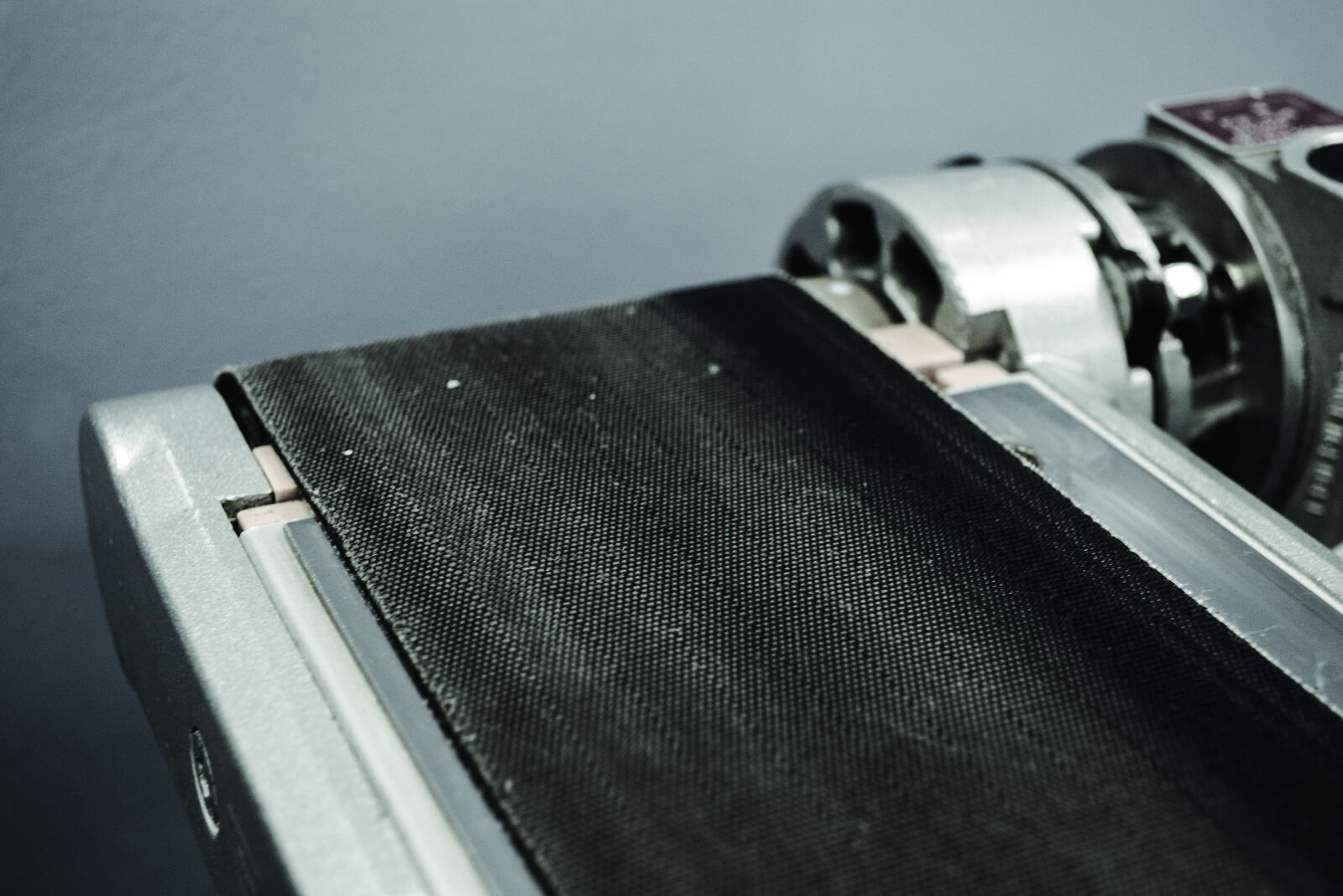 Nikon D3100 sample photo. Belt, black, factory, machine photography