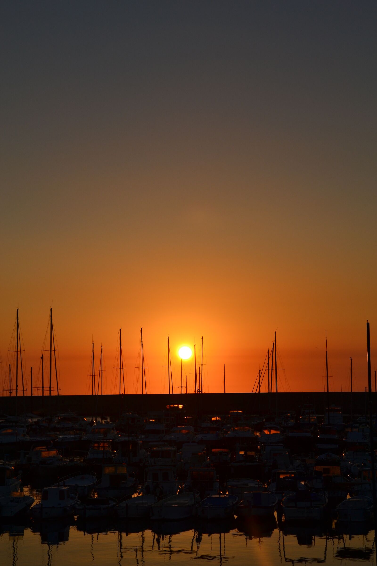 Nikon D3100 sample photo. Sunset, coast, boats photography