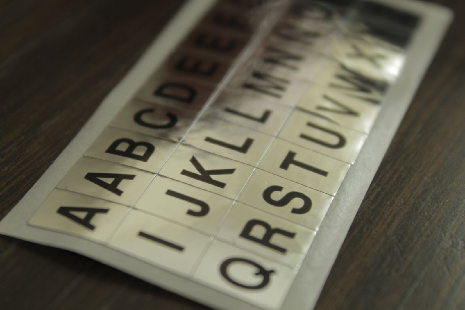Canon EOS 1300D (EOS Rebel T6 / EOS Kiss X80) sample photo. Low key, letters, stickers photography