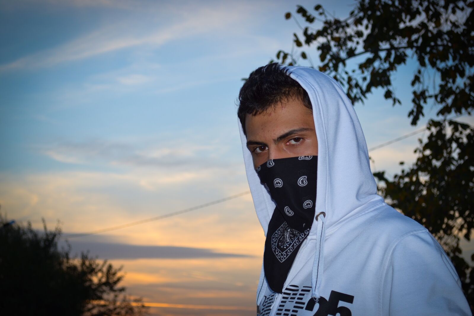 Nikon D3100 sample photo. Guy, teenager, covered face photography