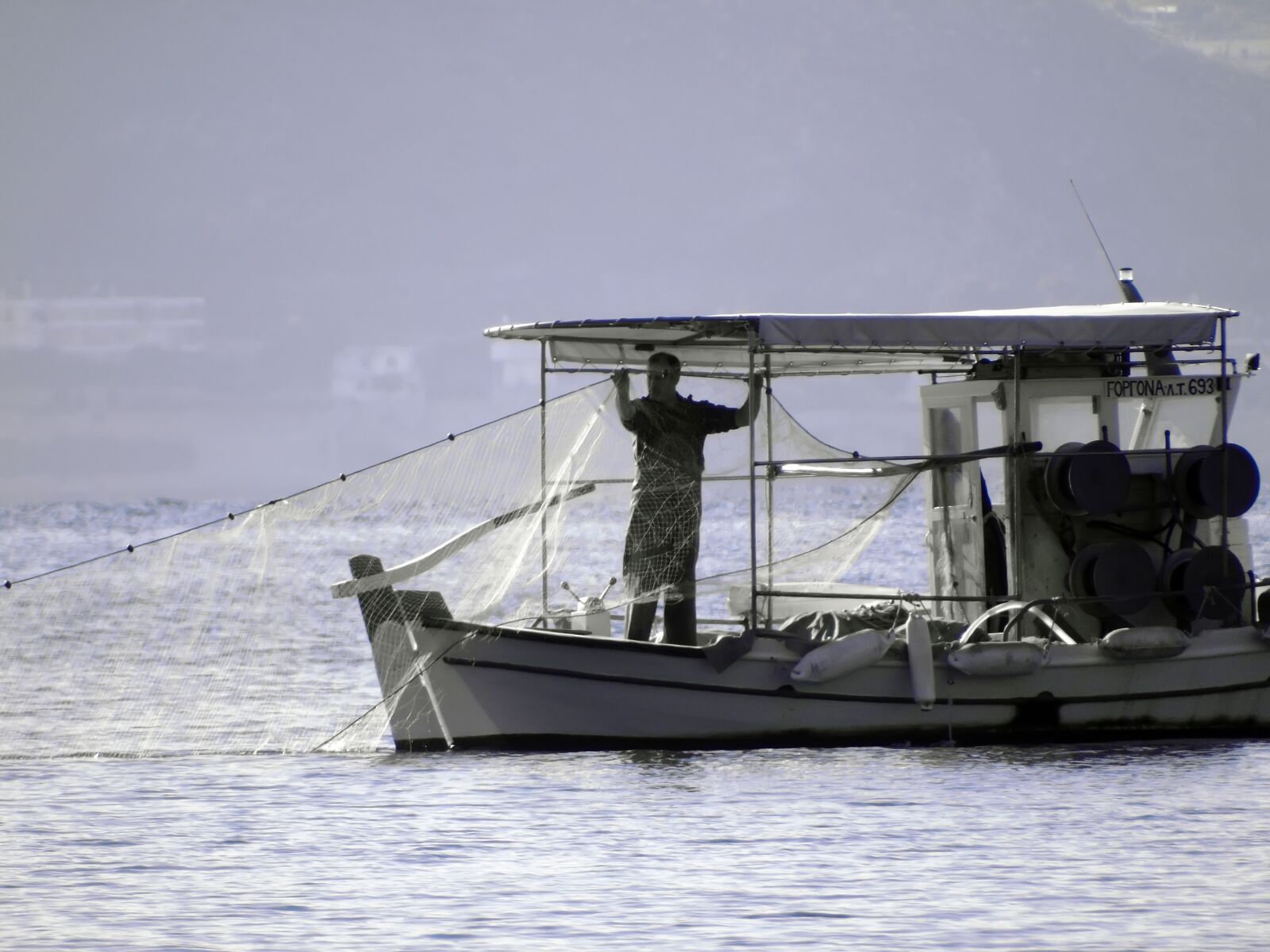 Sony Cyber-shot DSC-H400 sample photo. Fisherman, boat, fishing photography