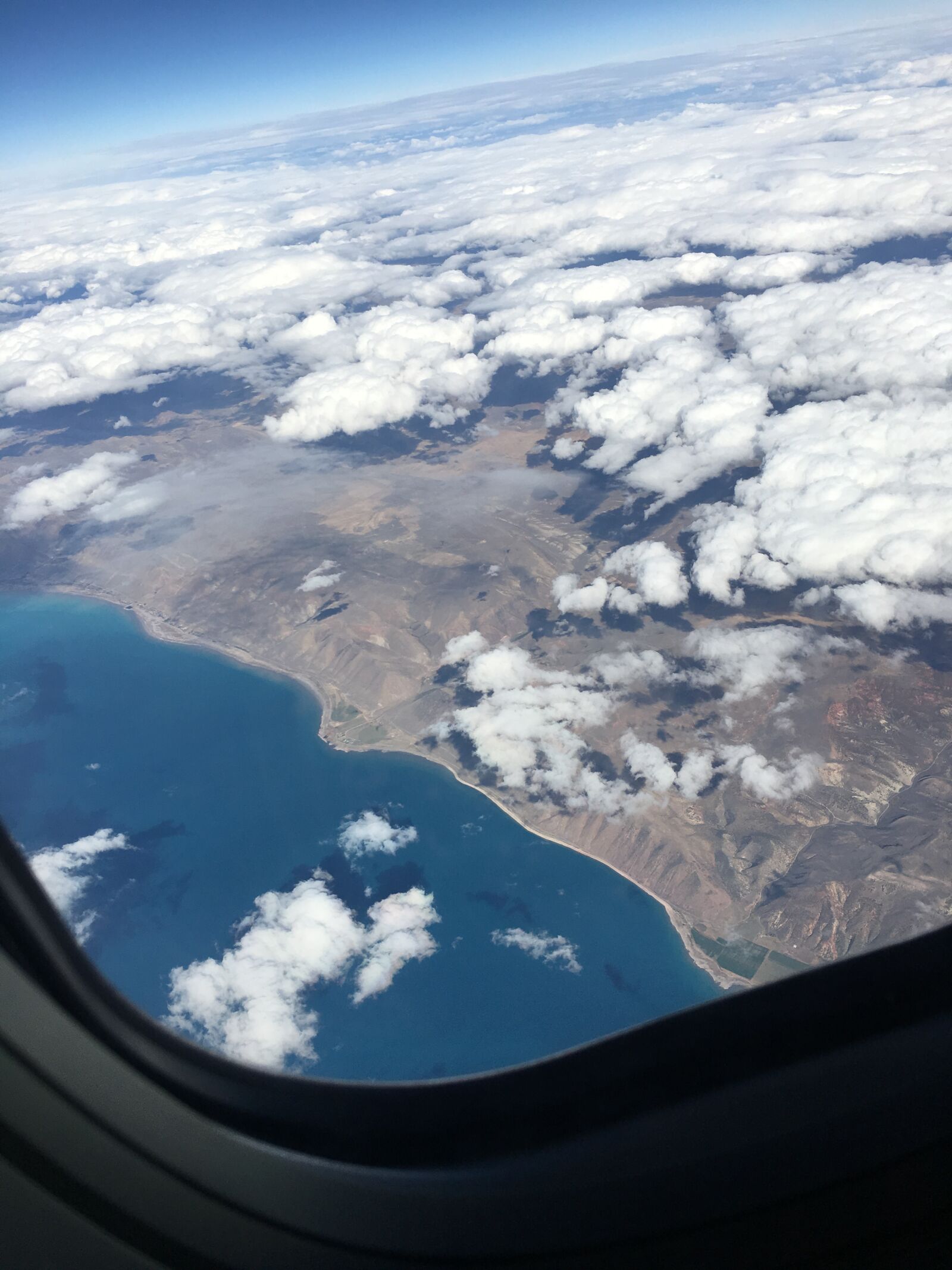 iPhone 6s Plus back camera 4.15mm f/2.2 sample photo. Airplane, window, clouds photography