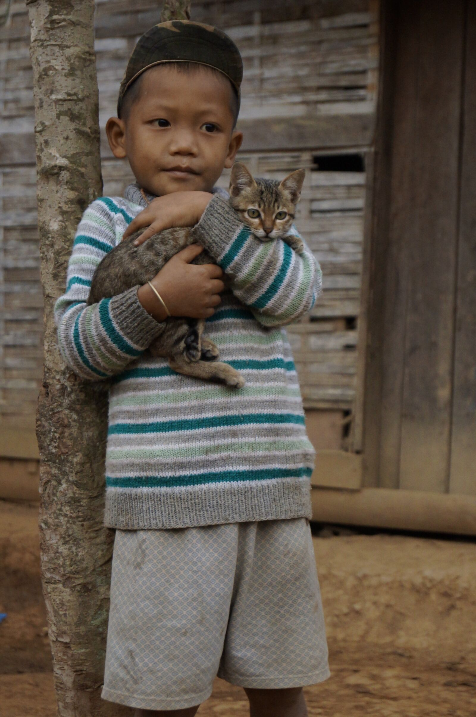 Sony SLT-A57 sample photo. Asia, laos, boy with photography