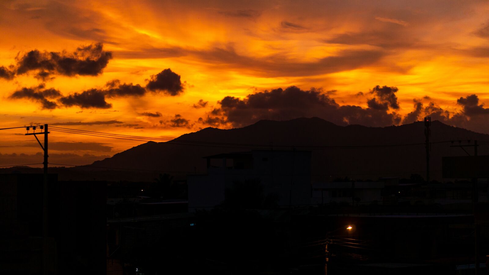 E 50mm F1.8 OSS sample photo. Sunset, sun, orange photography