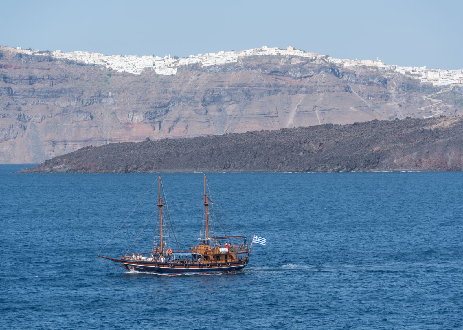 Sony a7R II + Sony FE 24-240mm F3.5-6.3 OSS sample photo. Santorini, pirate ship, mountains photography