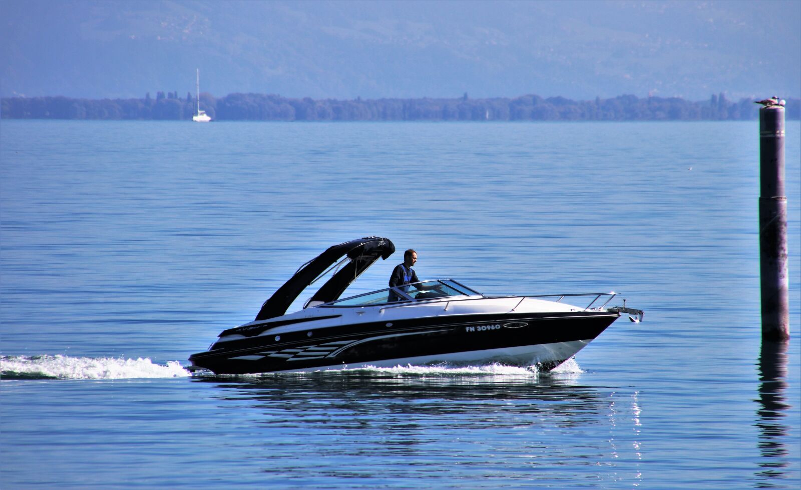 Canon EOS 80D sample photo. Water surface, lake, motorboat photography