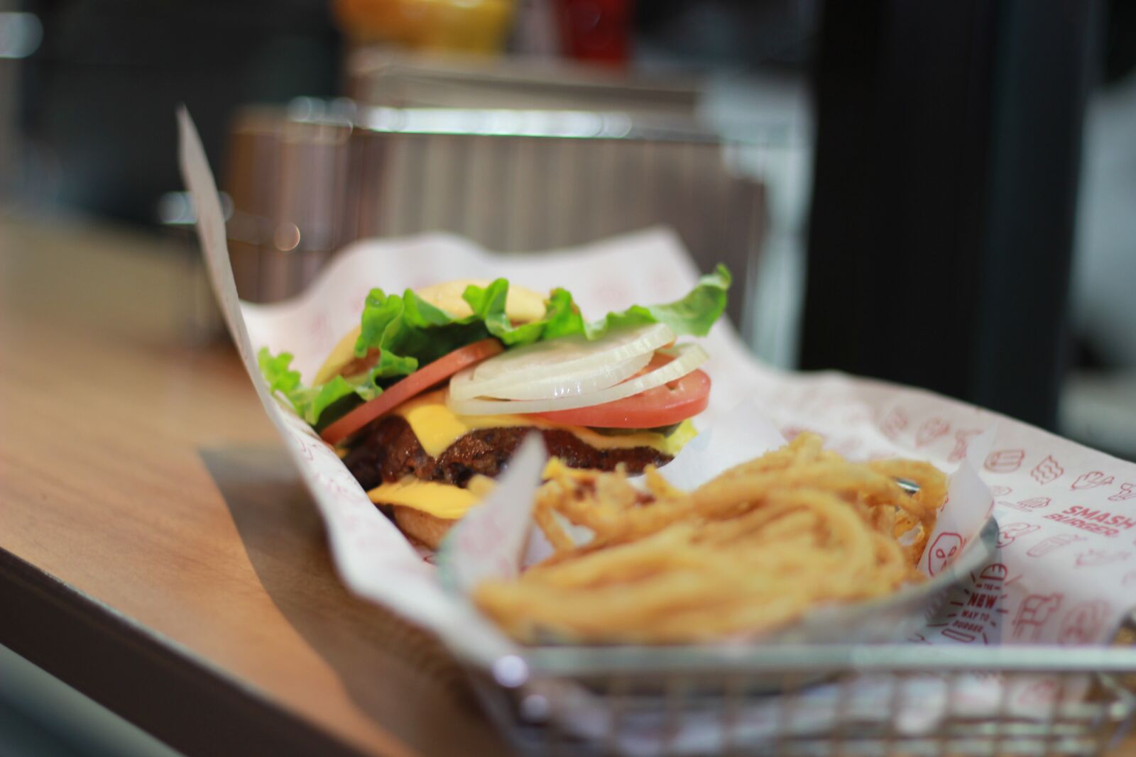 Canon EOS 60D + Canon EF 50mm F1.8 II sample photo. Burger, onion rings, fries photography