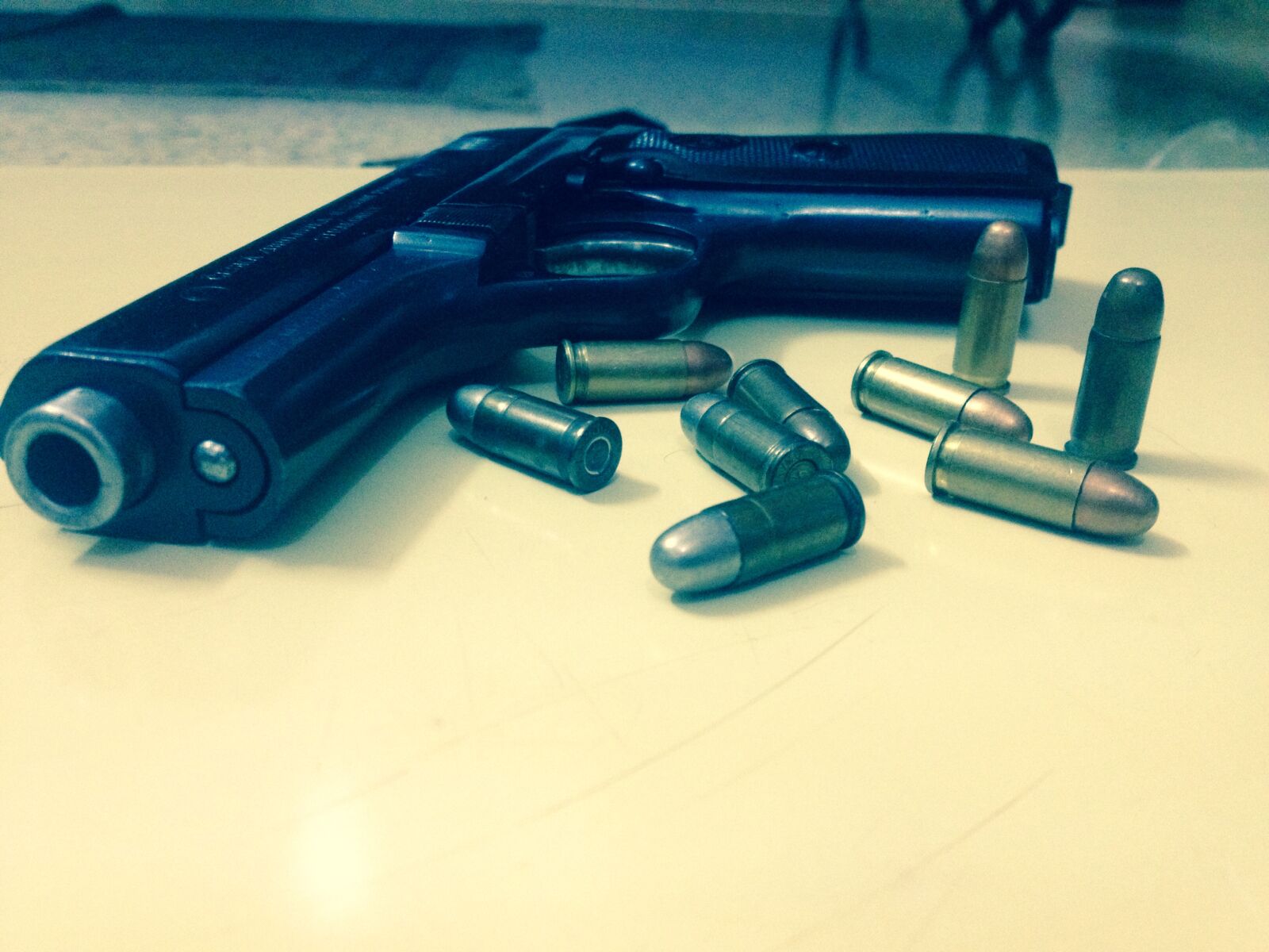 iPhone 4S back camera 4.28mm f/2.4 sample photo. Bullets, gun photography