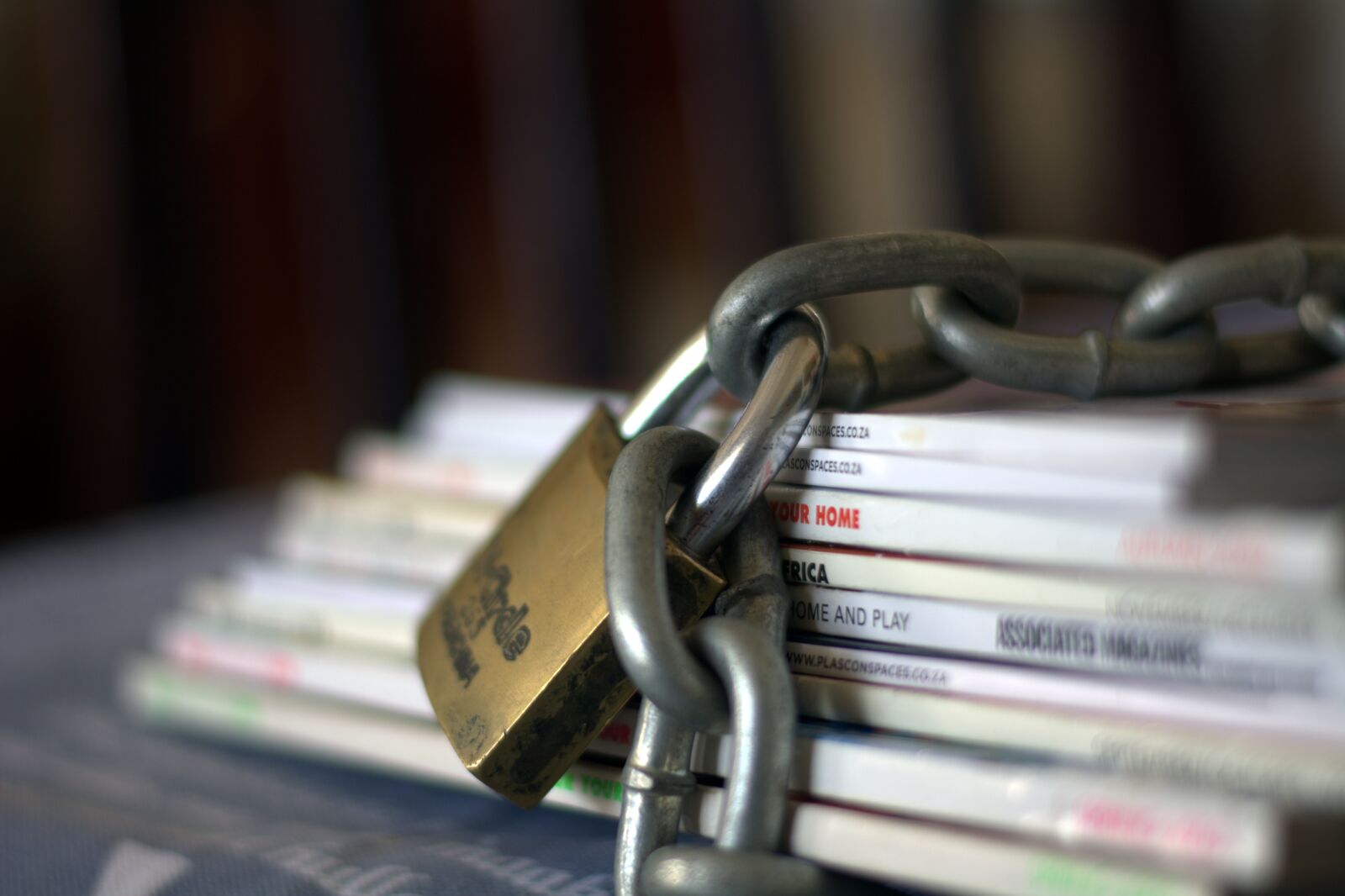Nikon D5200 sample photo. Chained magazines, paper, safe photography