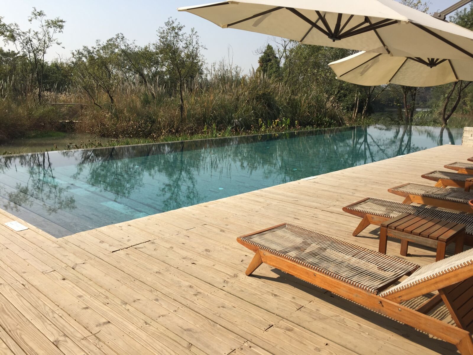 Apple iPhone 6 sample photo. Hotel, swimming pool, bed photography