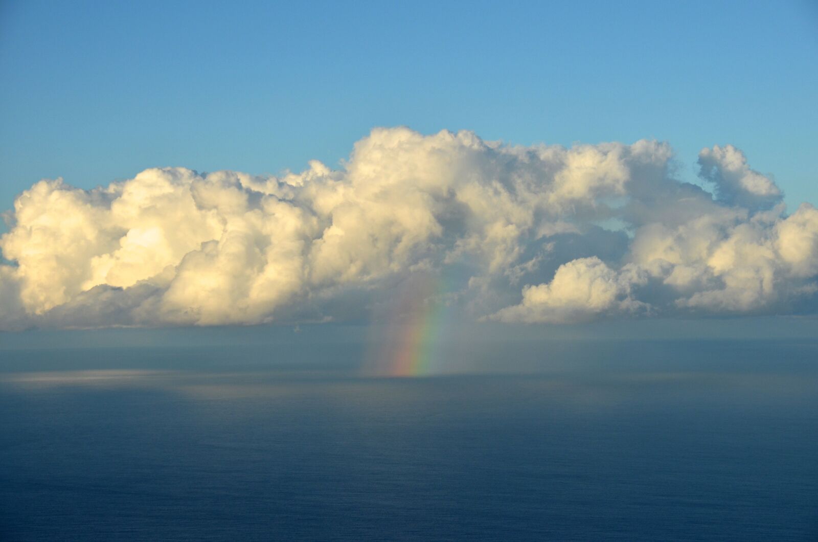 Nikon D5100 sample photo. Cloud, rainbow, sea photography
